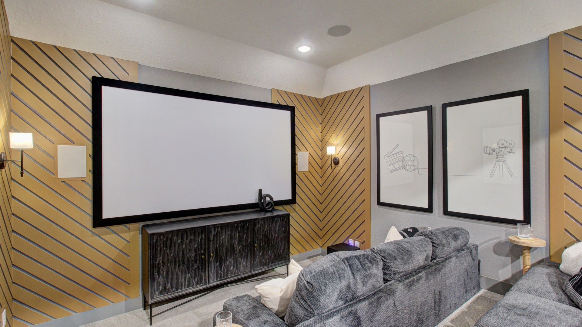 Experience elegant cinema with sleek diagonal wood panels and plush seating in Verandas at the Rim, Texas.