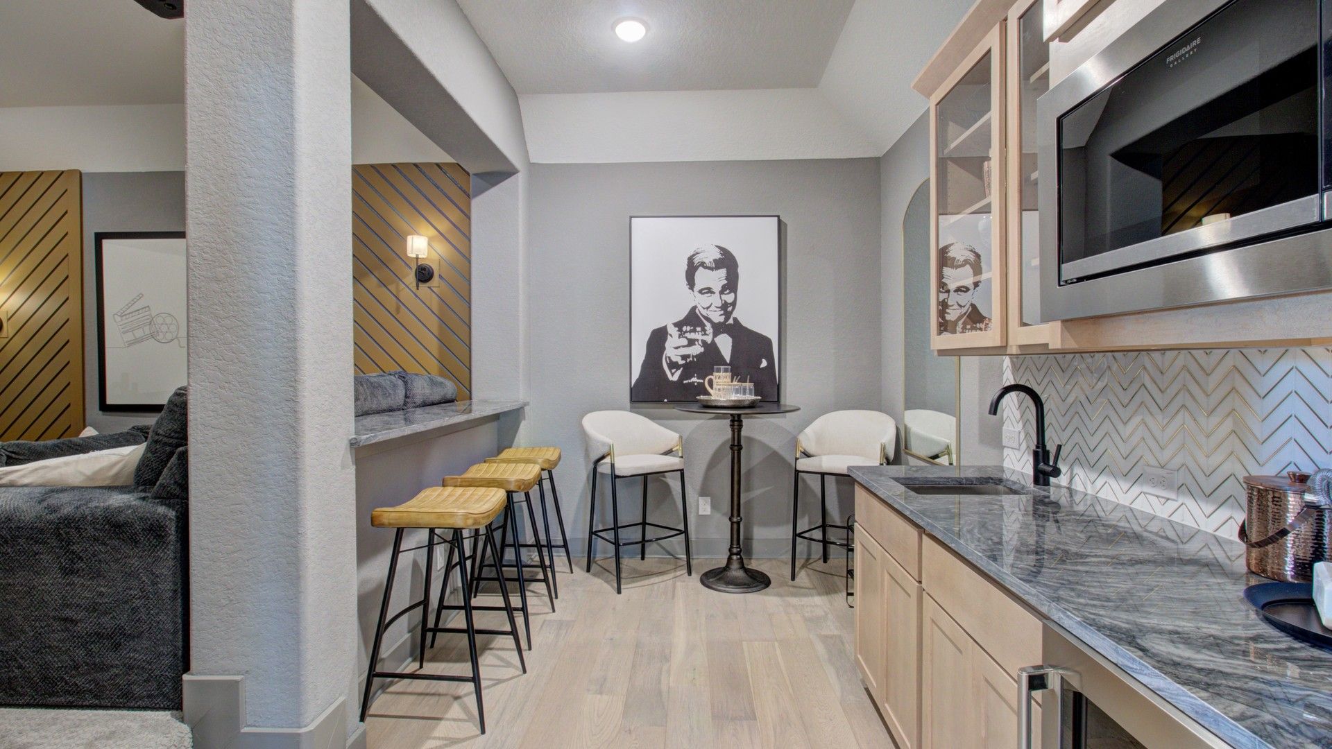 Experience luxury at Verandas at the Rim with a marble countertop, fine wood cabinetry, and chic artwork.