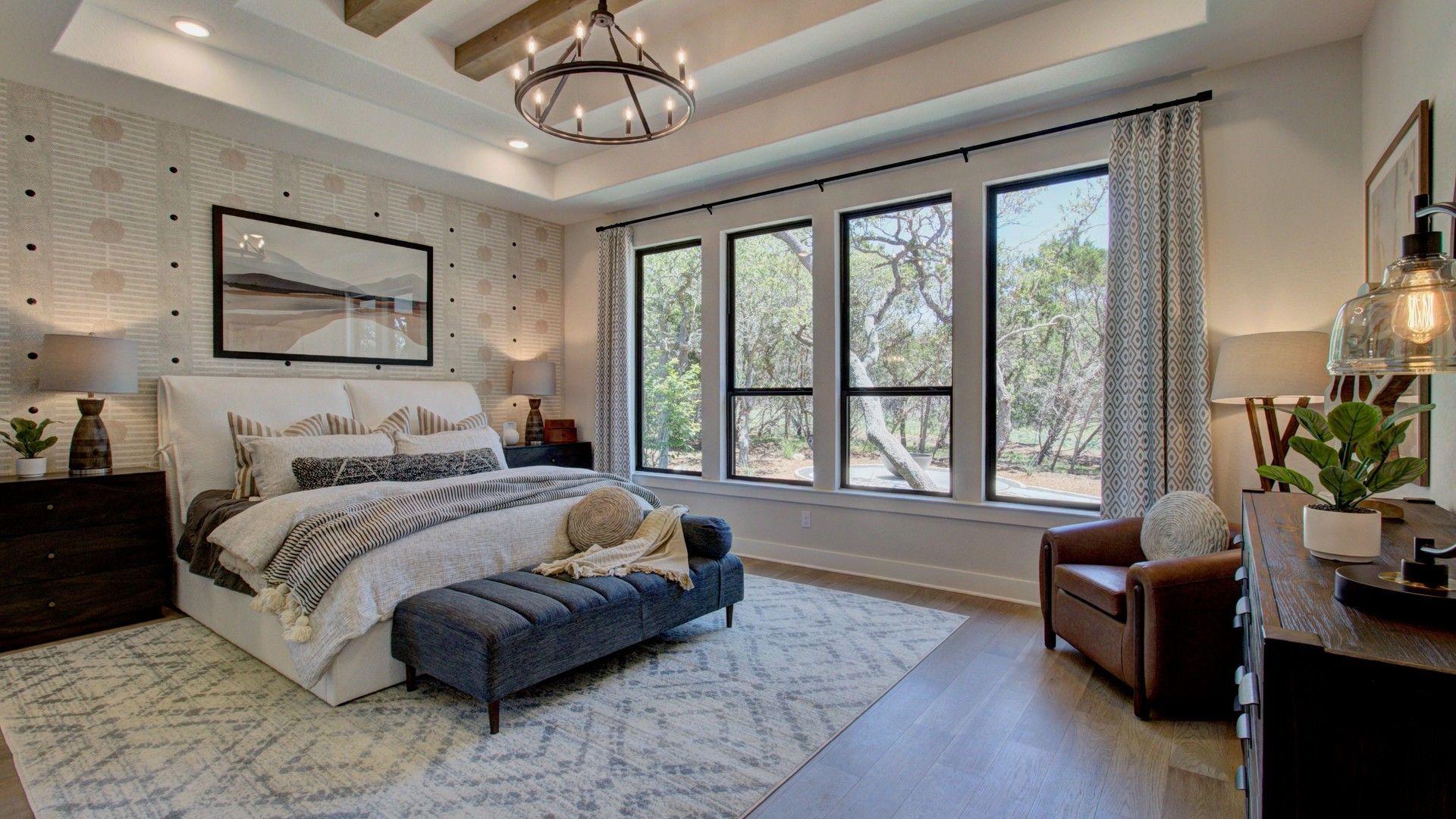 Tray ceiling with exposed beams enhances this stylish San Antonio retreat at Verandas at the Rim.