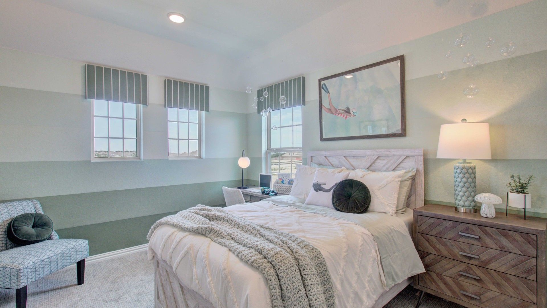 Experience refined comfort with chic accents and ample light in this Meyer Ranch bedroom.