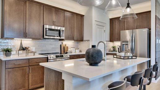 Elegant kitchen design with quartz countertops and premium wood cabinetry in Hunters Glen.