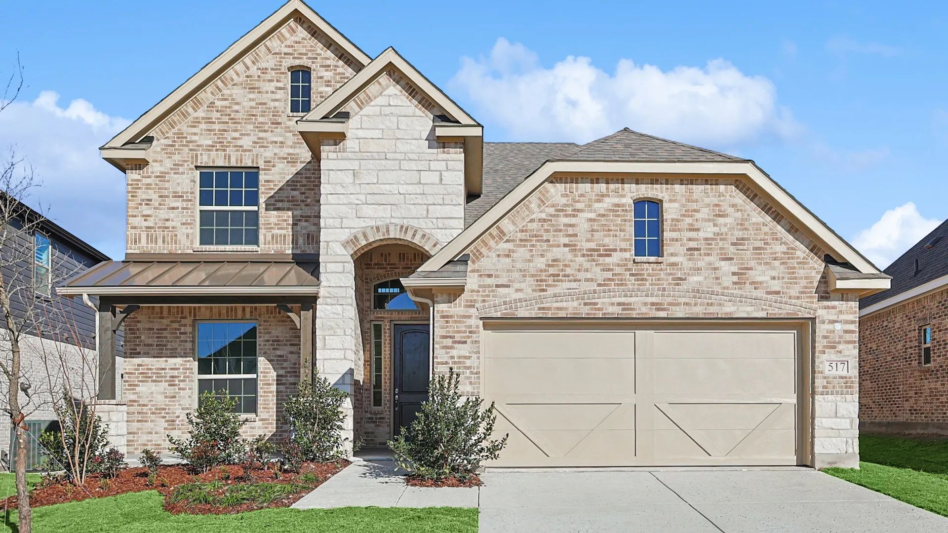 Experience elegance with this Infinity Square home featuring exquisite brickwork and a gabled roof.