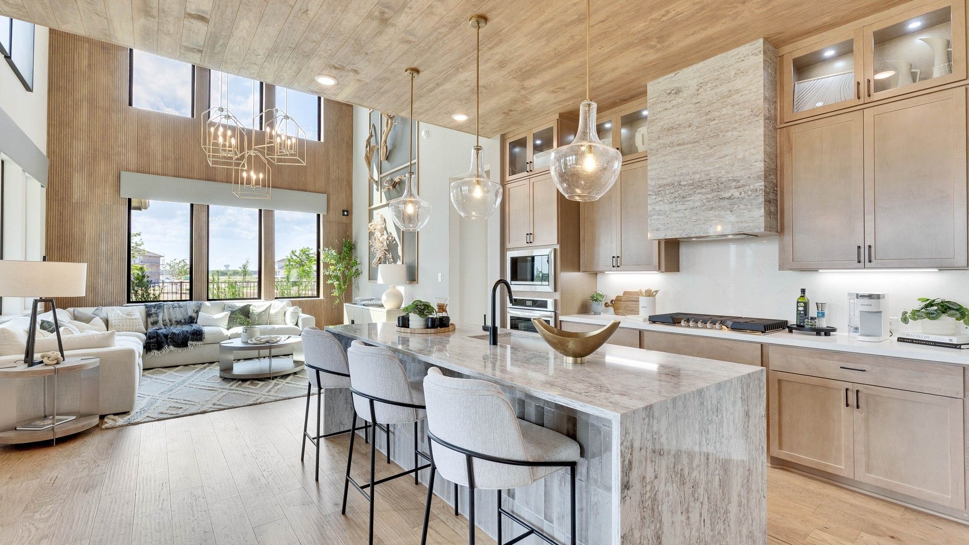 Exquisite marble countertops and soaring ceilings create luxury in Lakeside Meadows' elegant home.