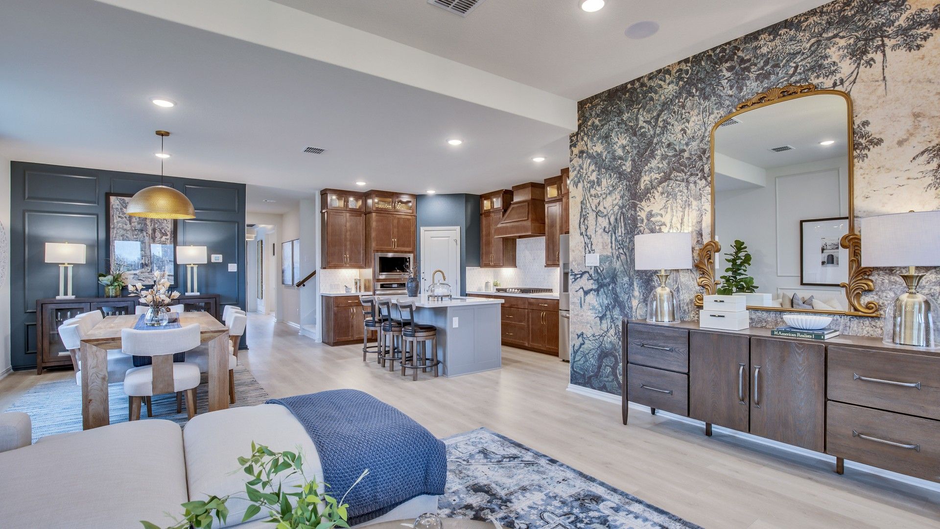 Luxurious open living space featuring chic wallpaper and premium hardwood floors at Opal Ranch.