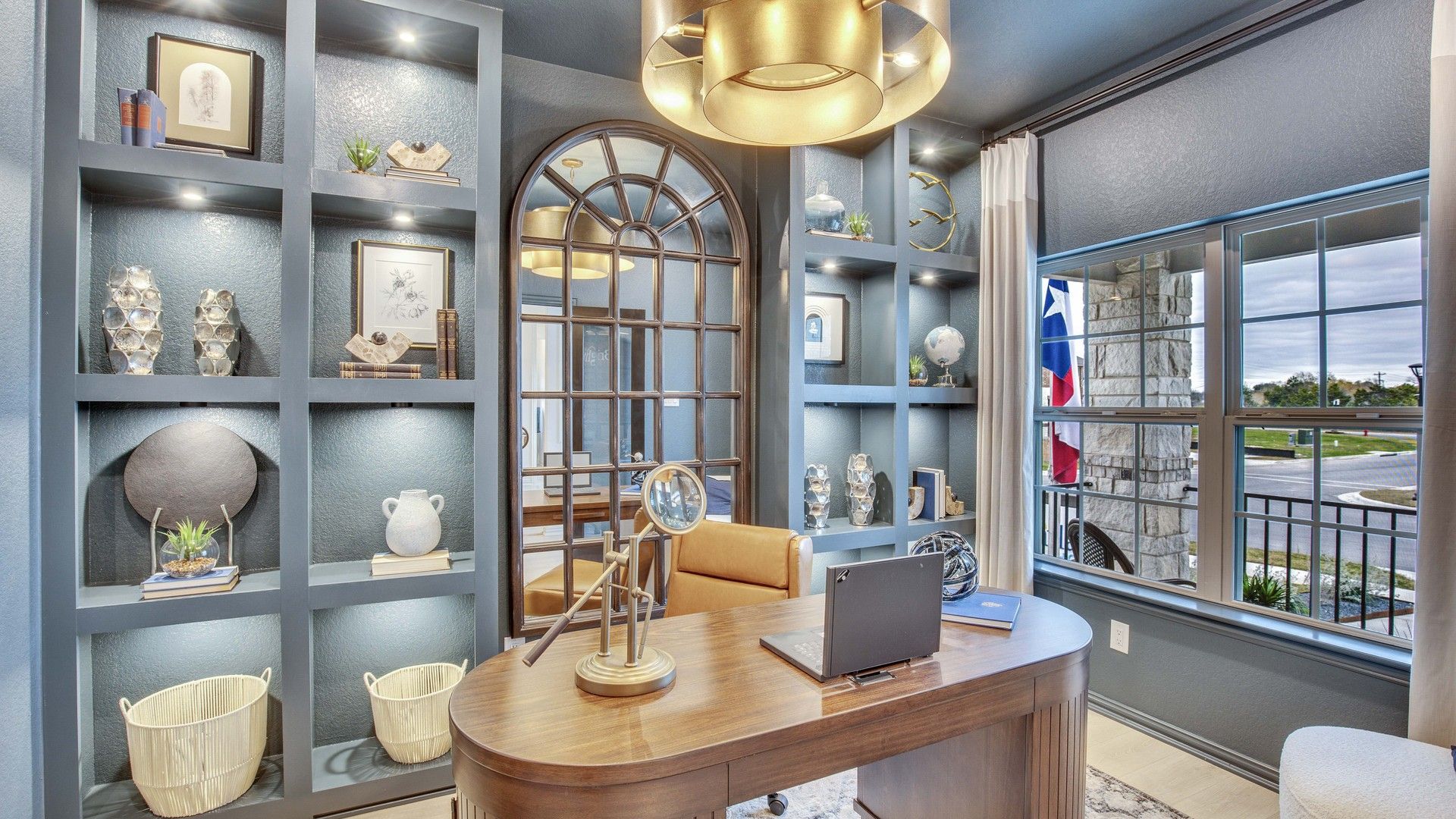 Opal Ranch office boasts custom shelving, rich wood desk, and grand arched mirror, blending sophistication with modern design.