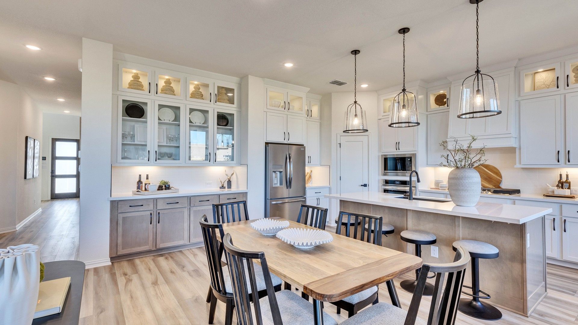Bask in modern luxury with chic pendant lighting and sleek cabinetry in this Briarwood kitchen.