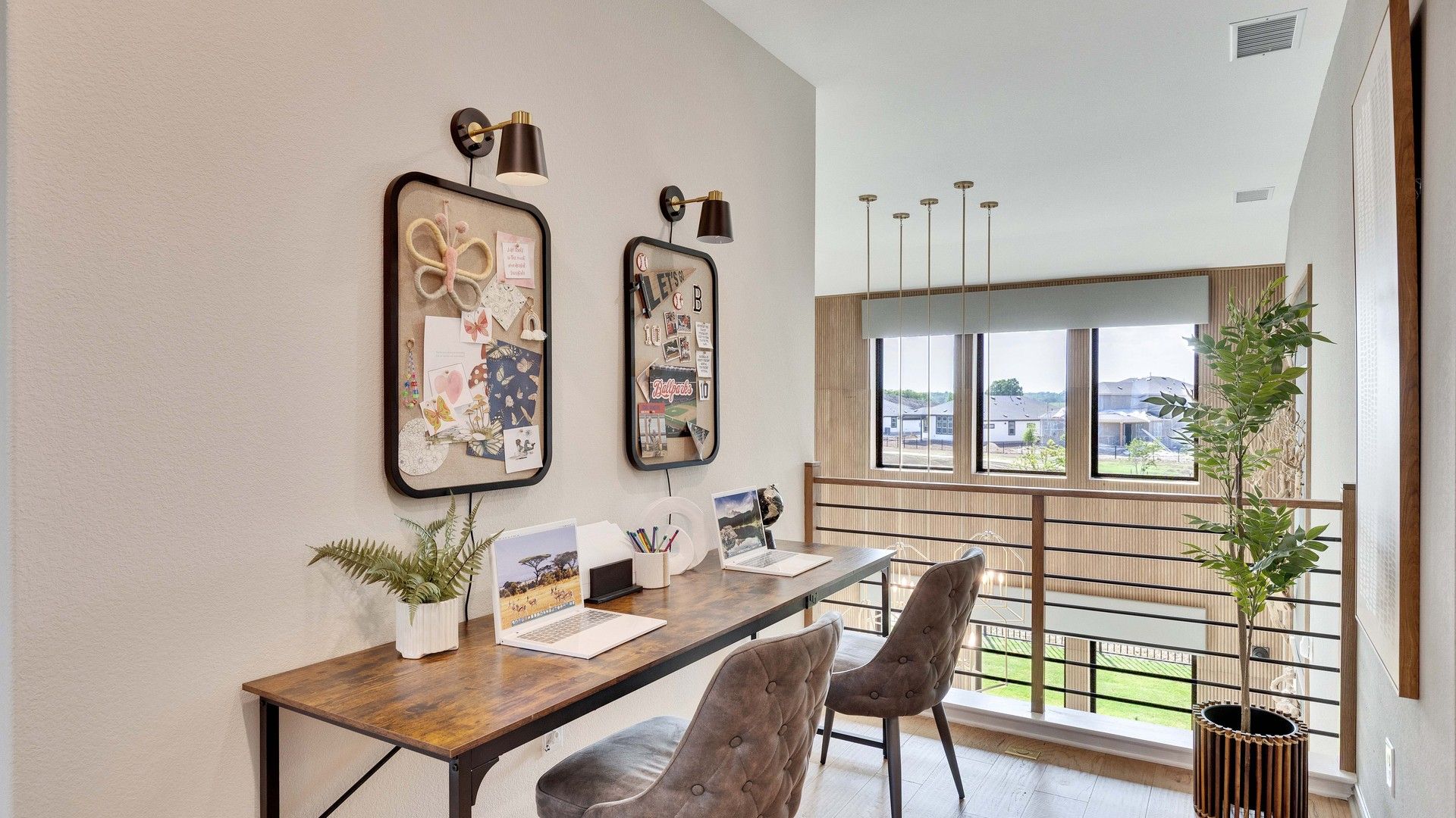 Sleek desk, chic lighting, and expansive windows embody refined living in Lakeside Meadows.
