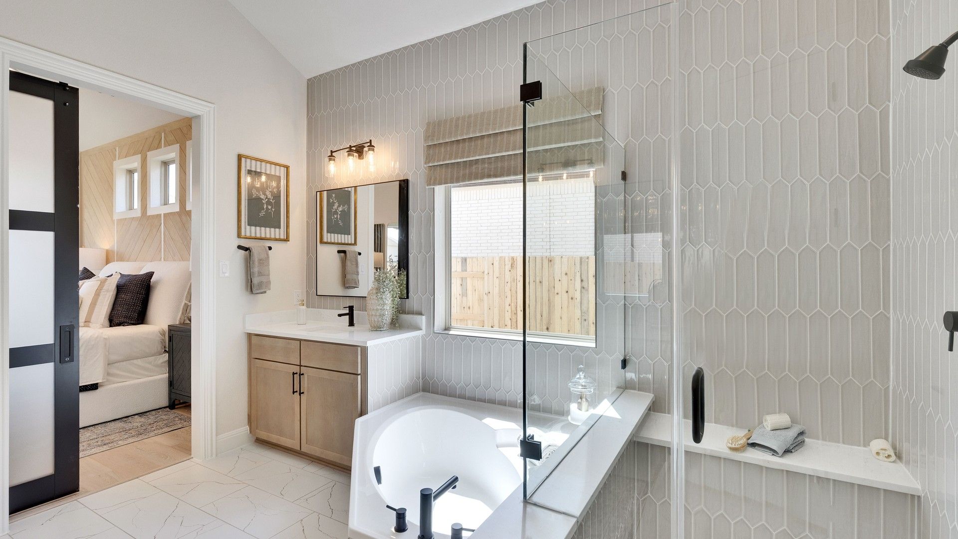 Indulge in luxury with hexagonal tiles and a sleek glass shower. Experience Sunfield's finest.