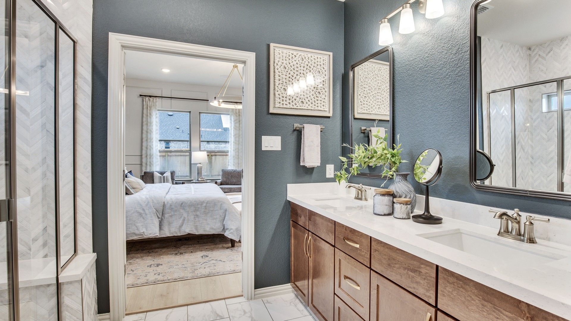 Luxurious marble tiles and elegant wood cabinetry enhance the Opal Ranch bathroom's refined aesthetics.