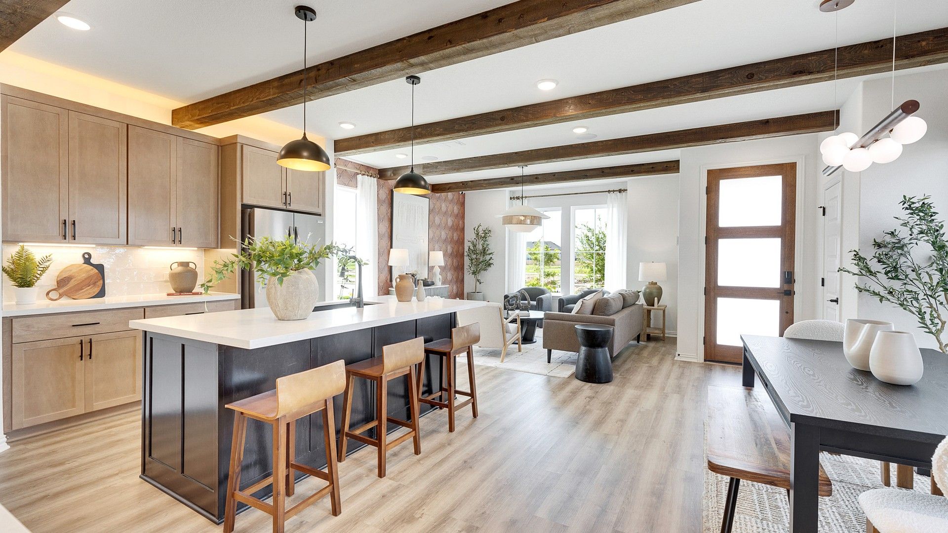 Bask in warmth with exposed wood beams and modern interiors in Spring Creek's upscale community.