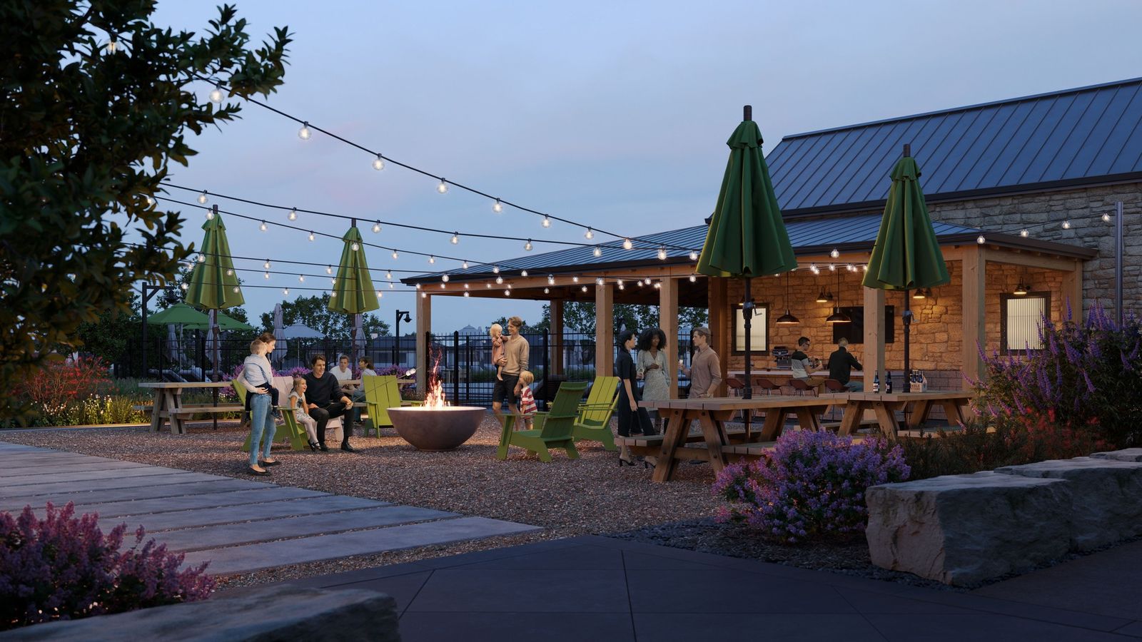 Revel in the Flora community's elegantly lit, stone-accented patio with charming string lights.