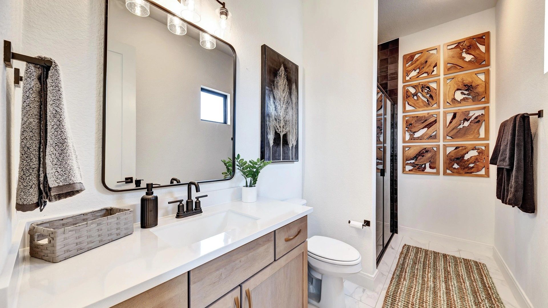 Luxurious bathroom with custom wood accents and modern fixtures in Hawkes Landing.
