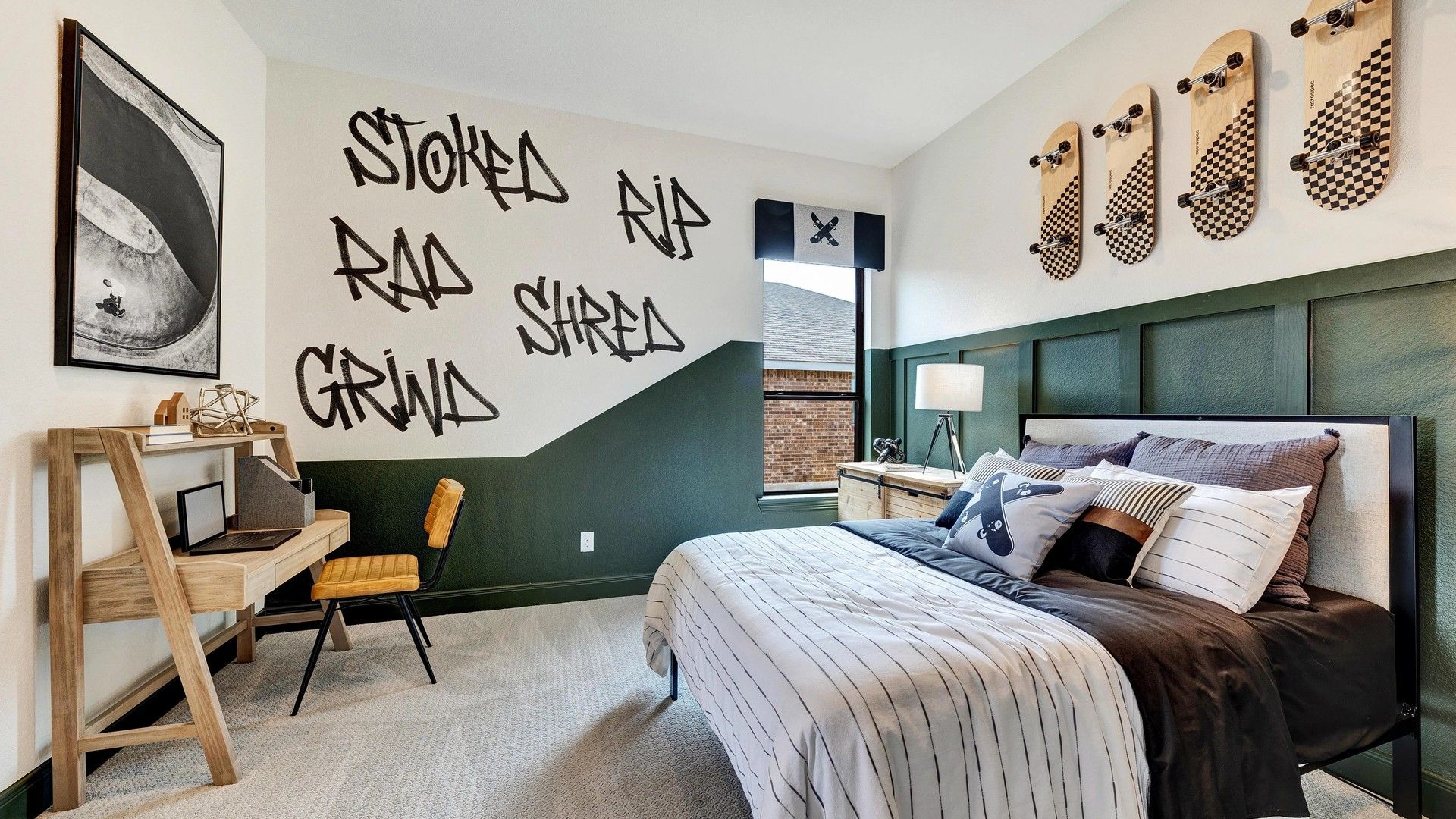 This Hawkes Landing teen room showcases unique skateboard wall art and custom graffiti design.
