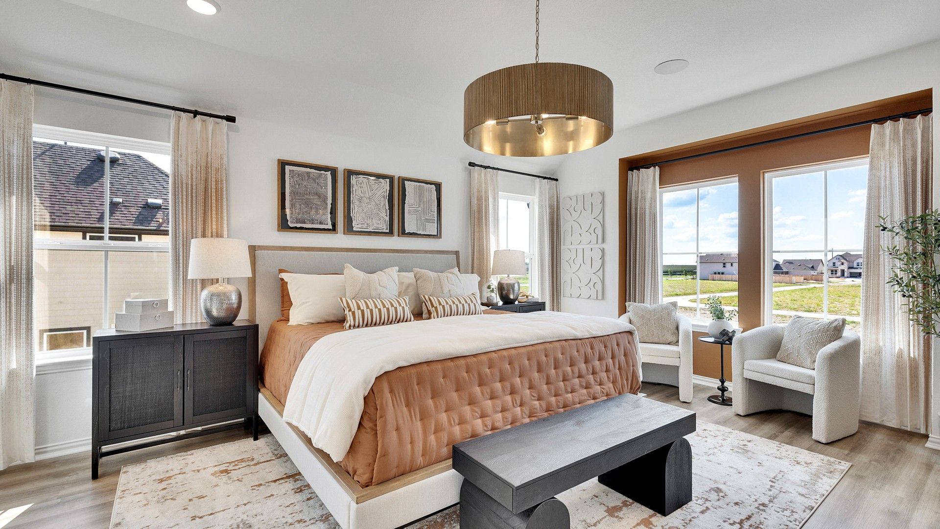 Discover refined elegance with sleek flooring, custom lighting, and expansive windows in Spring Creek's finest.