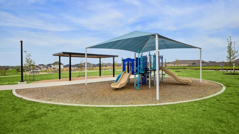 Discover the elegant playground with shaded slides and lush landscapes in Carillon community park.