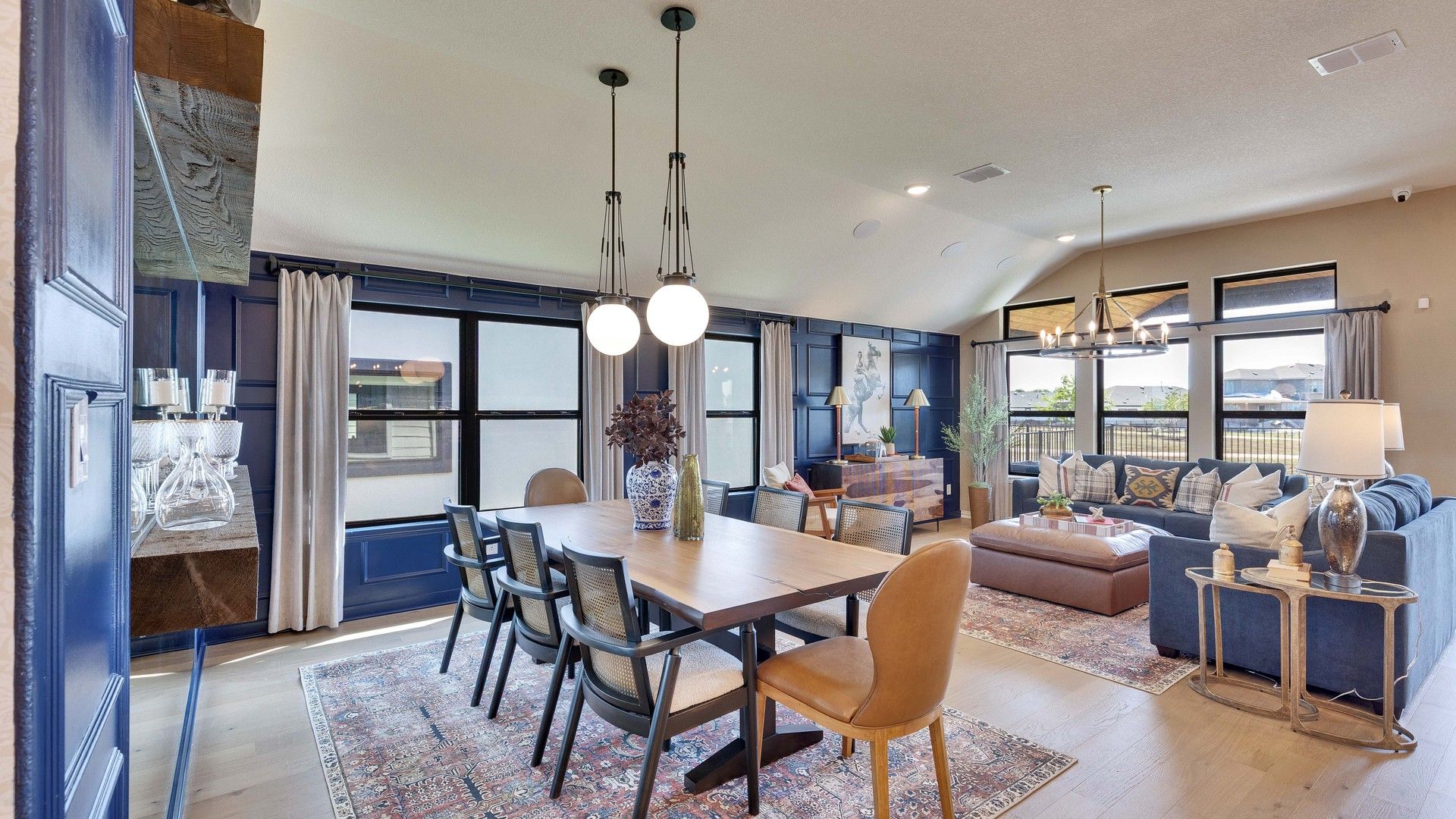 Experience high ceilings, chic lighting, and expansive windows in Lakeside Meadows' opulent open-concept design.