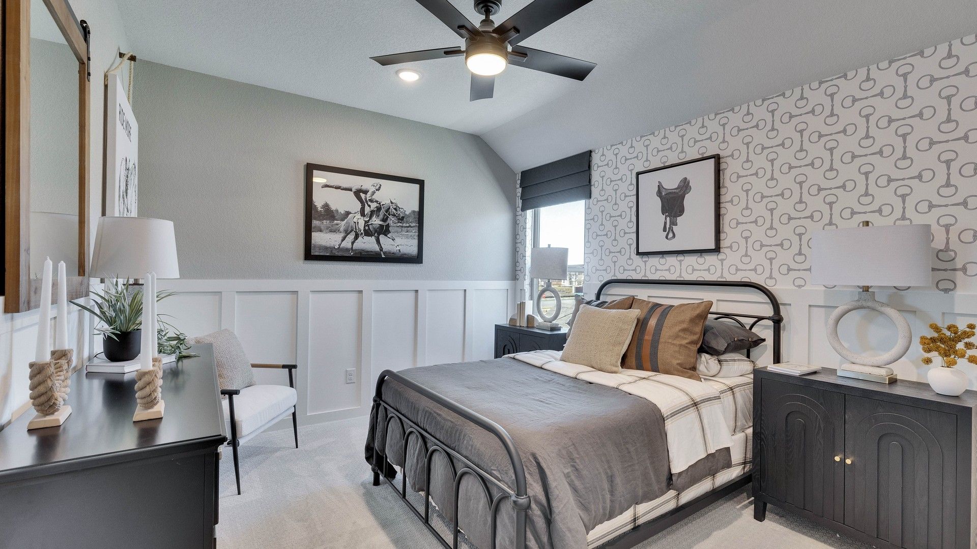 Elegant wainscoting and chic wallpaper define this Briarwood bedroom's sophisticated charm.