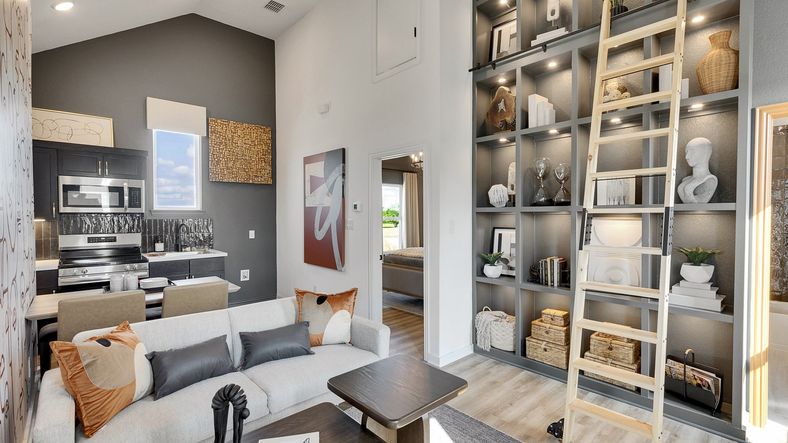 Exquisite high ceilings and bespoke shelving define this Spring Creek gem. Luxurious materials enhance elegance.