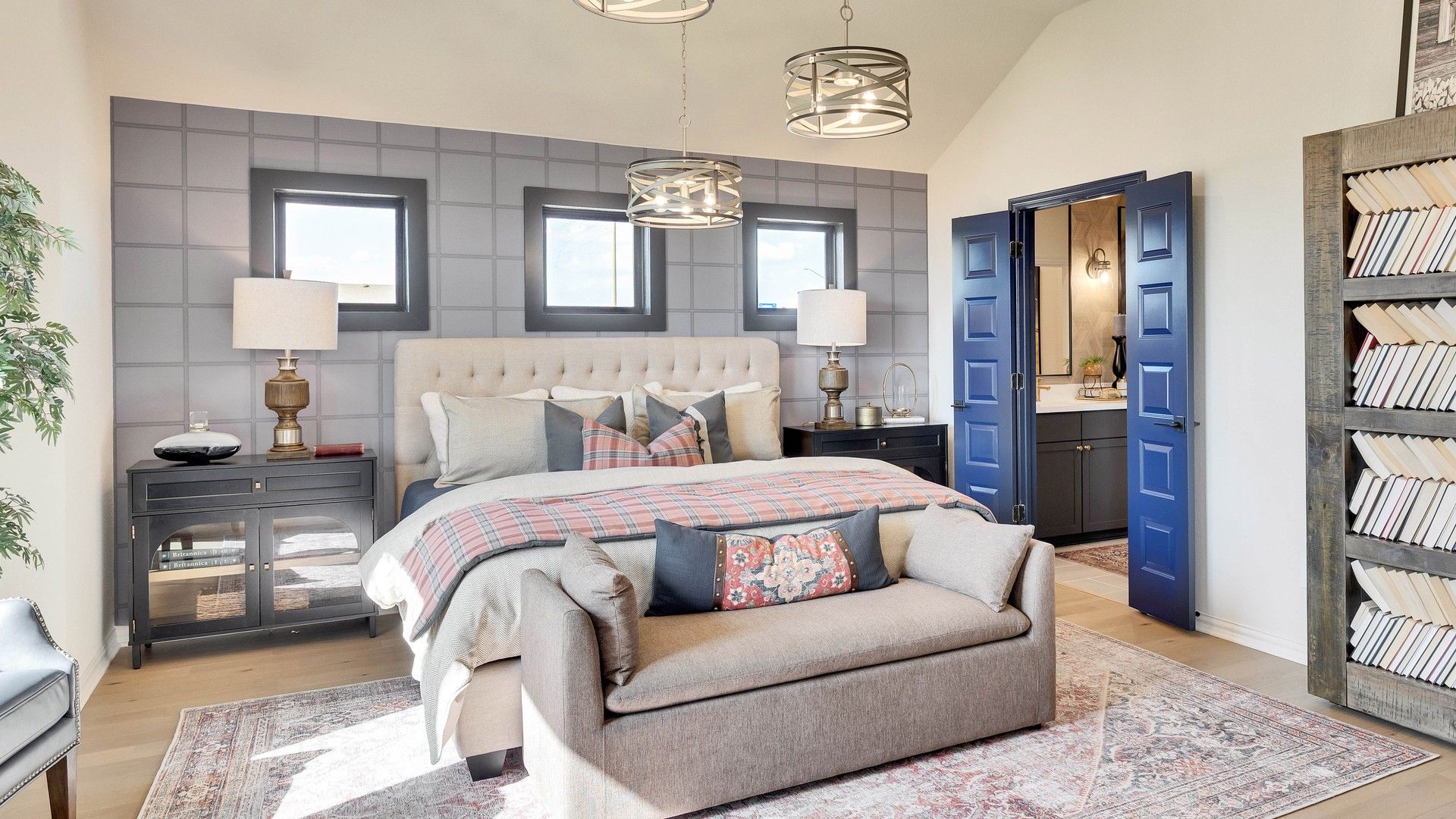 Discover refined elegance with plush furnishings, striking grey wall, and blue accents at Preserve, Lakeside Meadows.