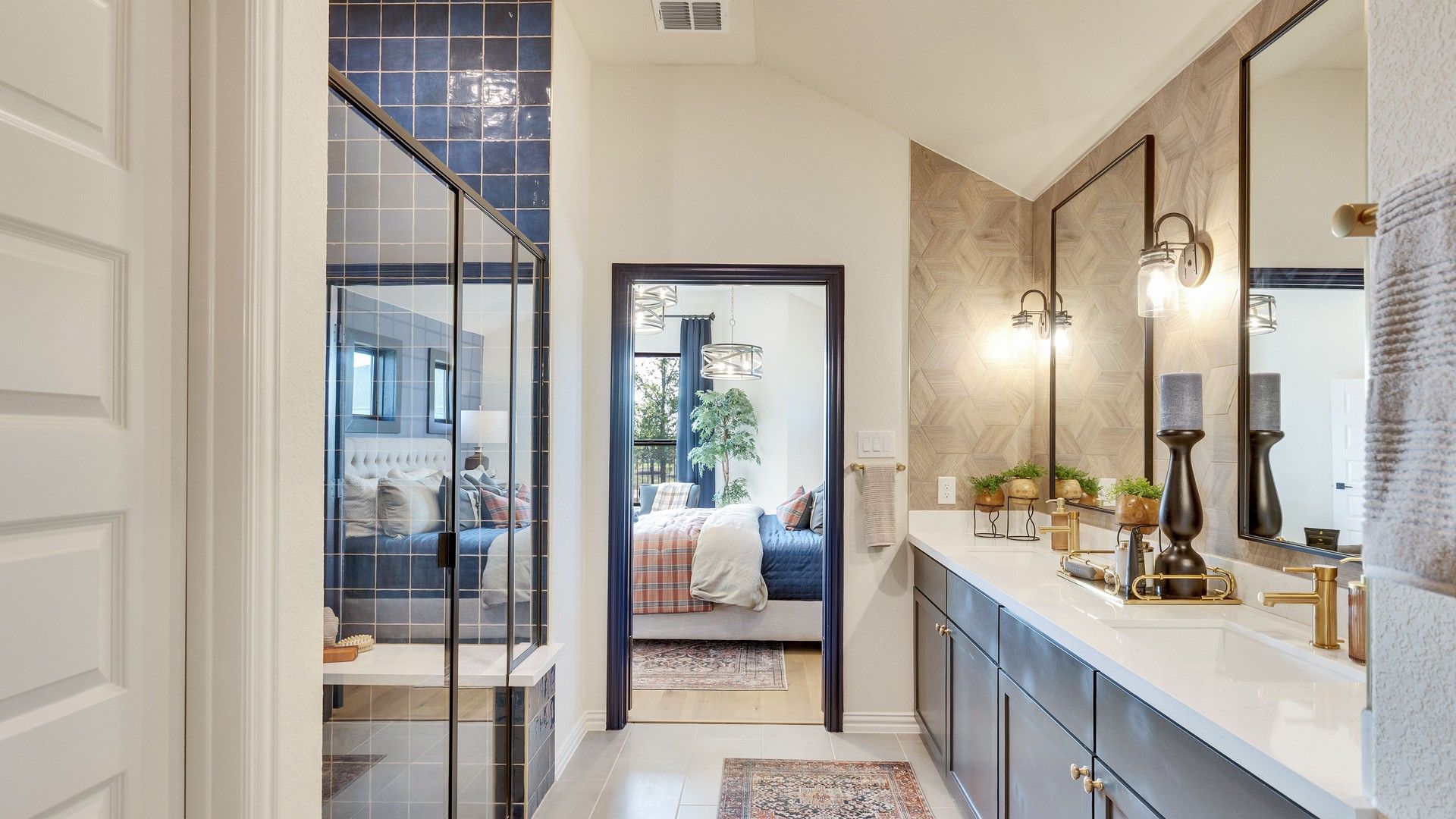 Opulent bathroom features exquisite geometric wall design, gold fixtures, blue tiles, located in Lakeside Meadows, Texas.