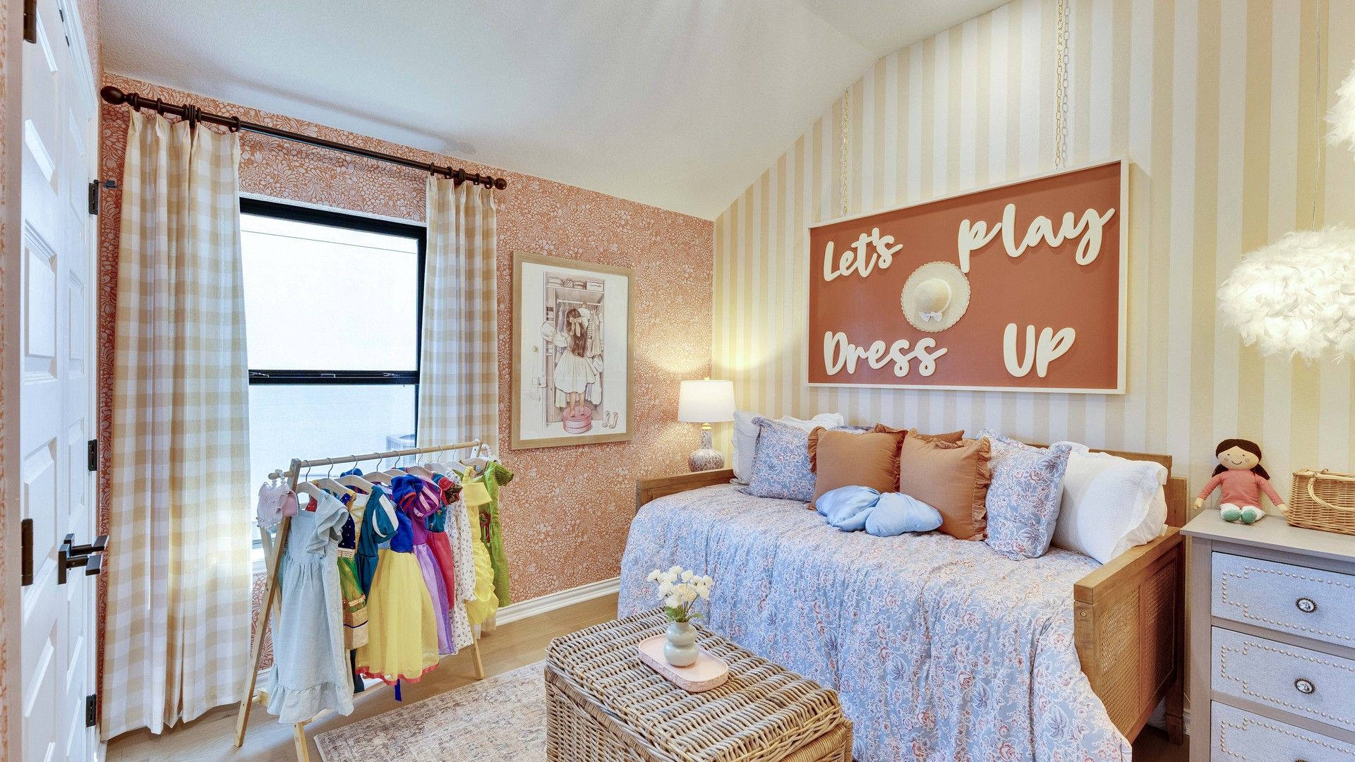 Vaulted ceiling and striped wallpaper elevate this children's bedroom in Lakeside Meadows.