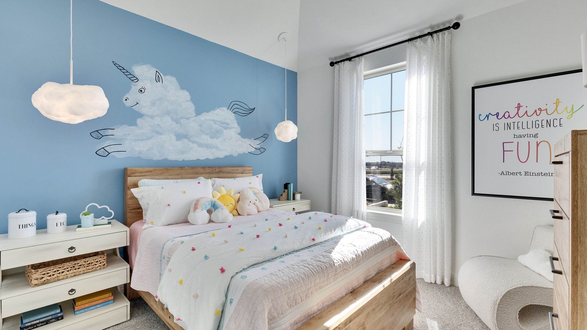 Delightful unicorn mural and plush bedding enhance this Briarwood bedroom’s whimsical charm.