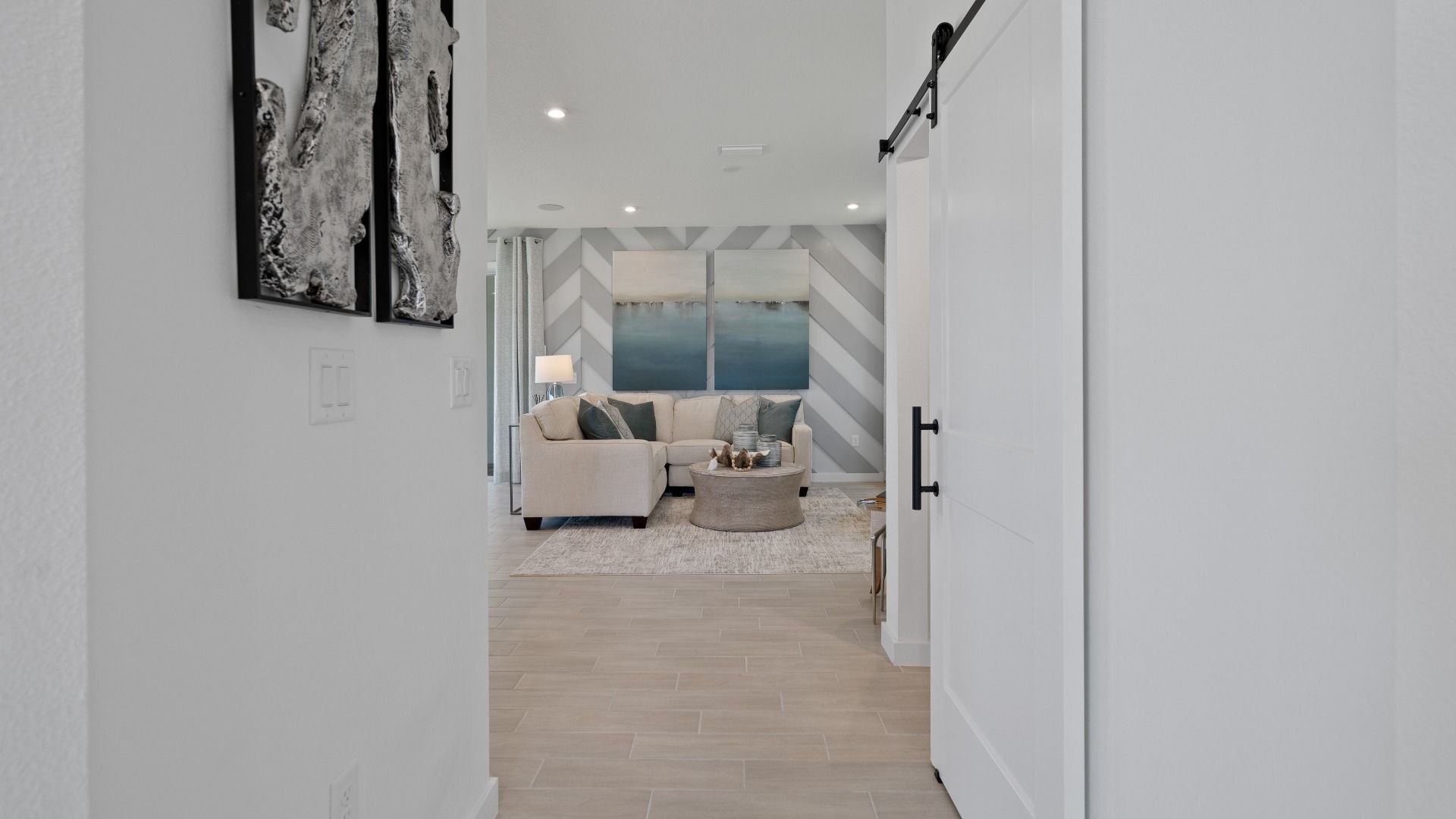 Trinity Place Staged Model Ambersweet Living Area by DRB Homes in Saint Cloud FL