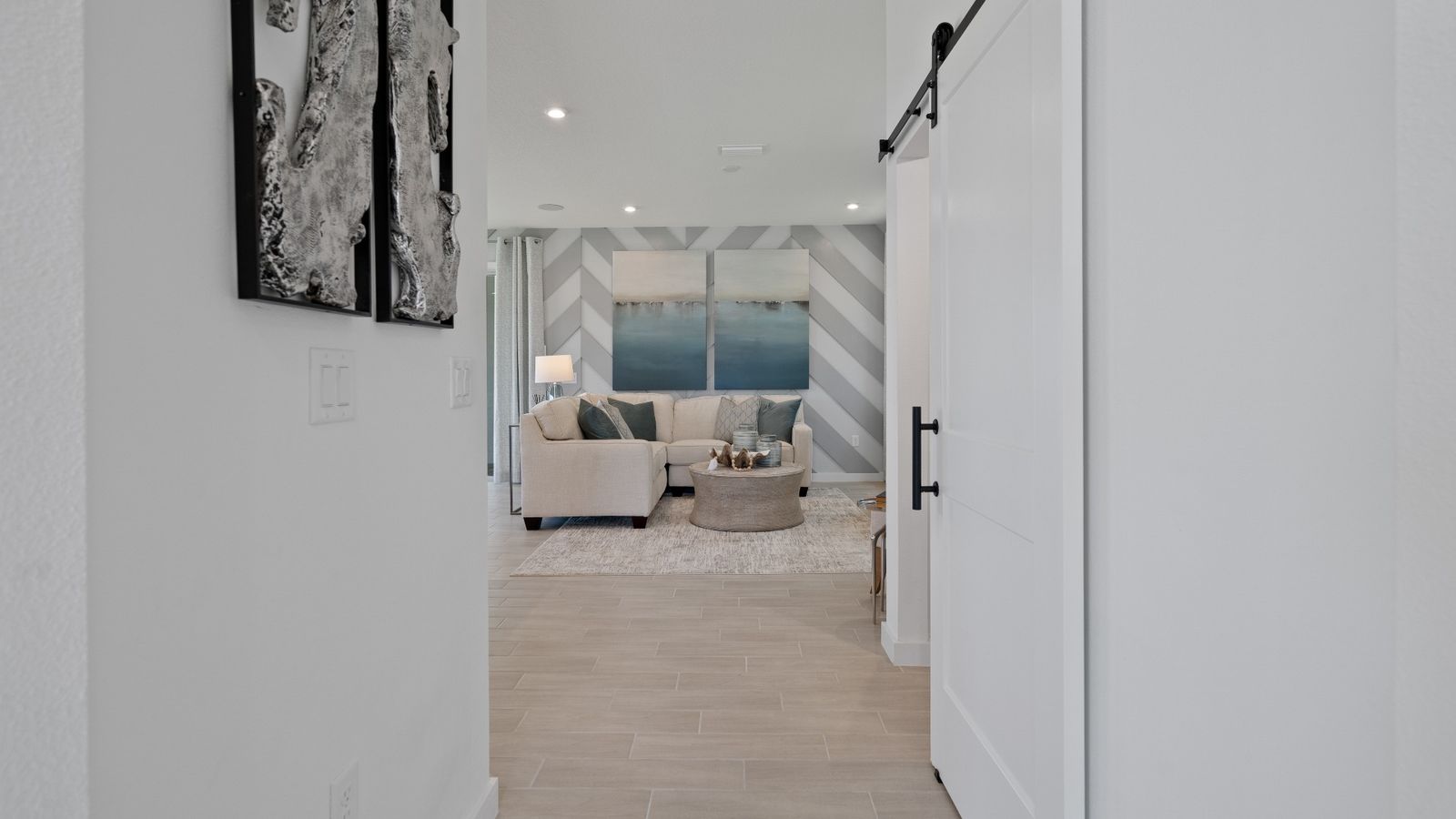 Trinity Place Staged Model Ambersweet Living Area by DRB Homes in Saint Cloud FL