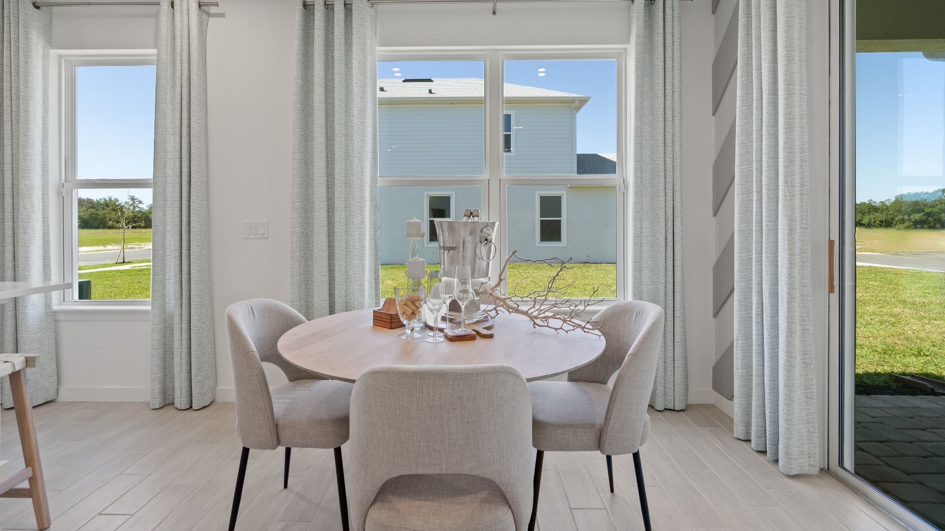 Trinity Place Staged Model Ambersweet Dining Area by DRB Homes in Saint Cloud FL