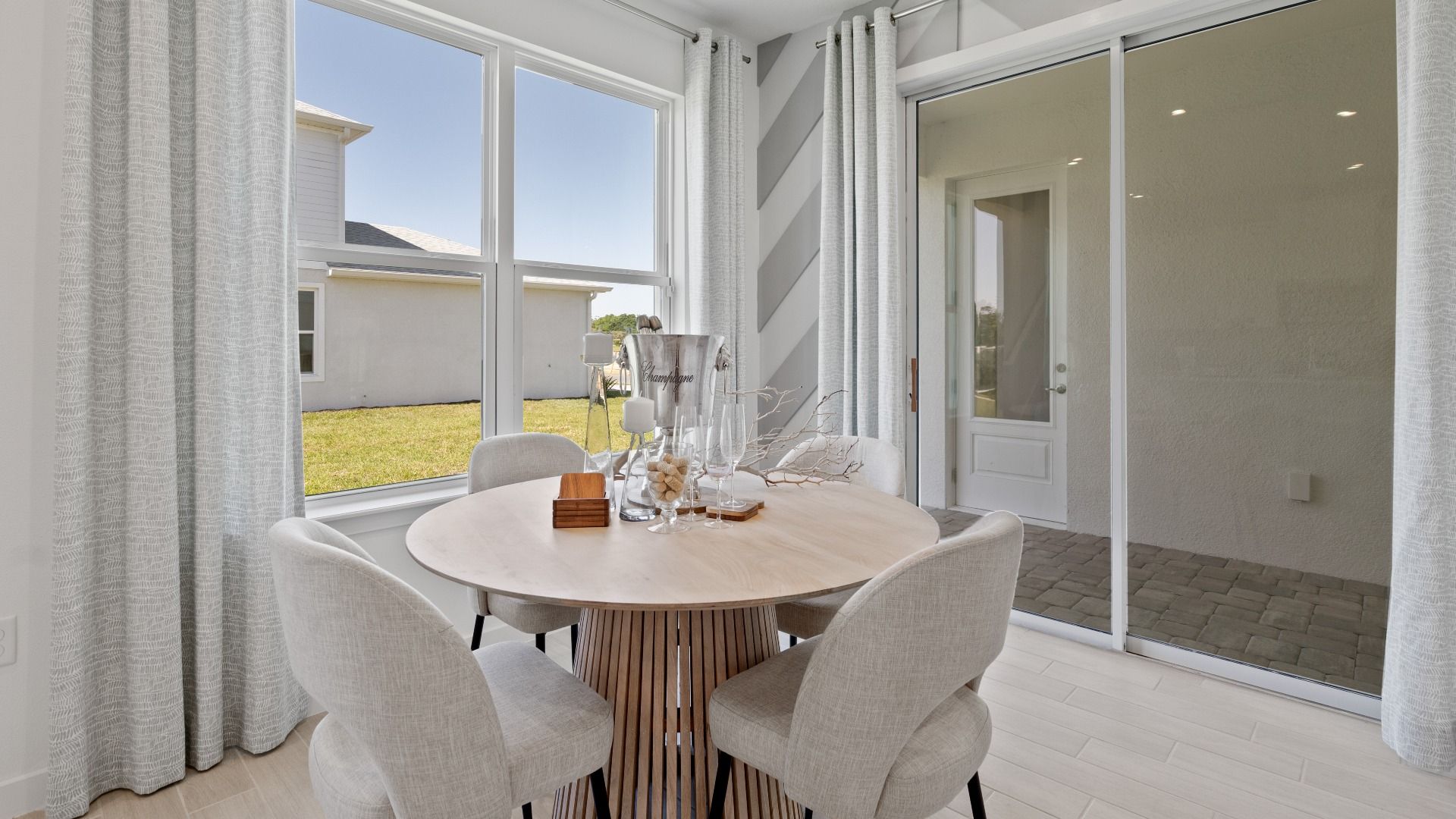 Trinity Place Staged Model Ambersweet Dining Area by DRB Homes in Saint Cloud FL