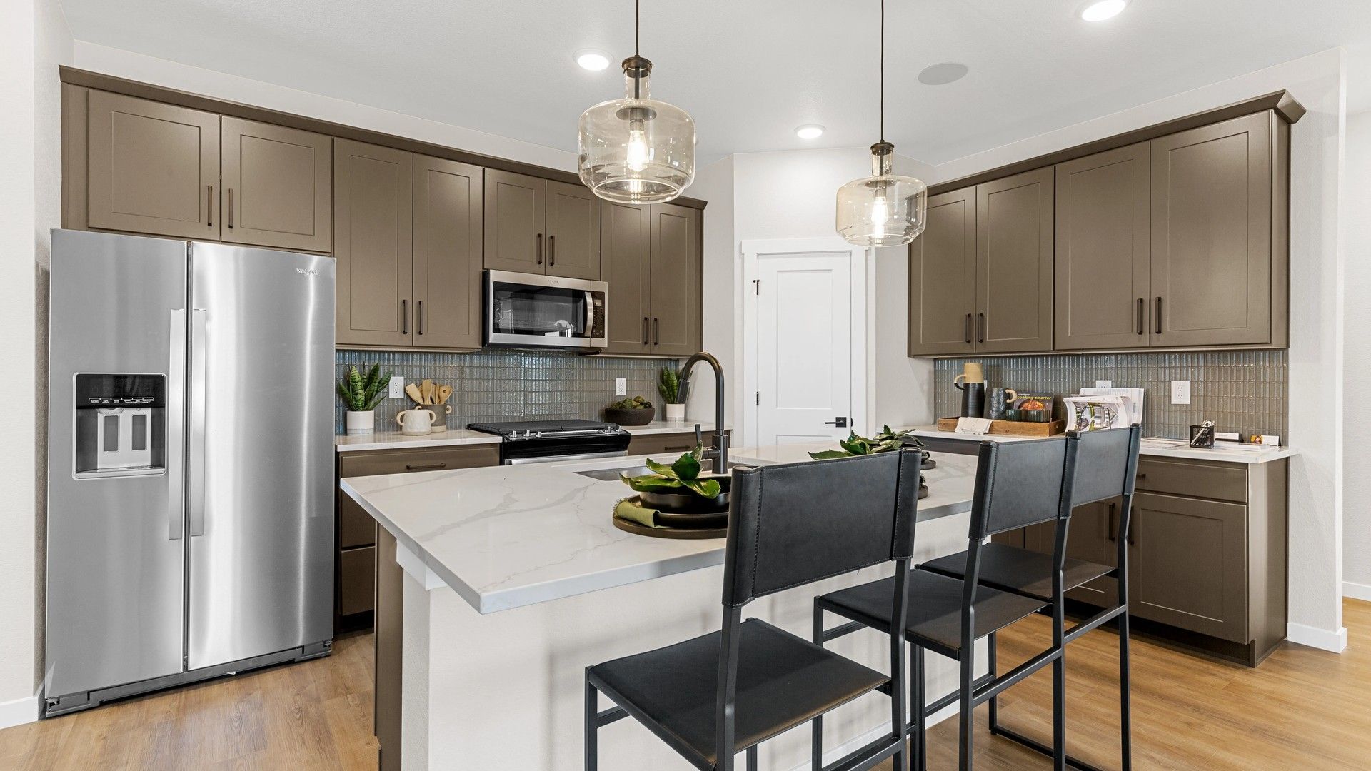 Experience modern elegance with quartz countertops, sophisticated cabinetry, and upscale finishes at Timnath Lakes.