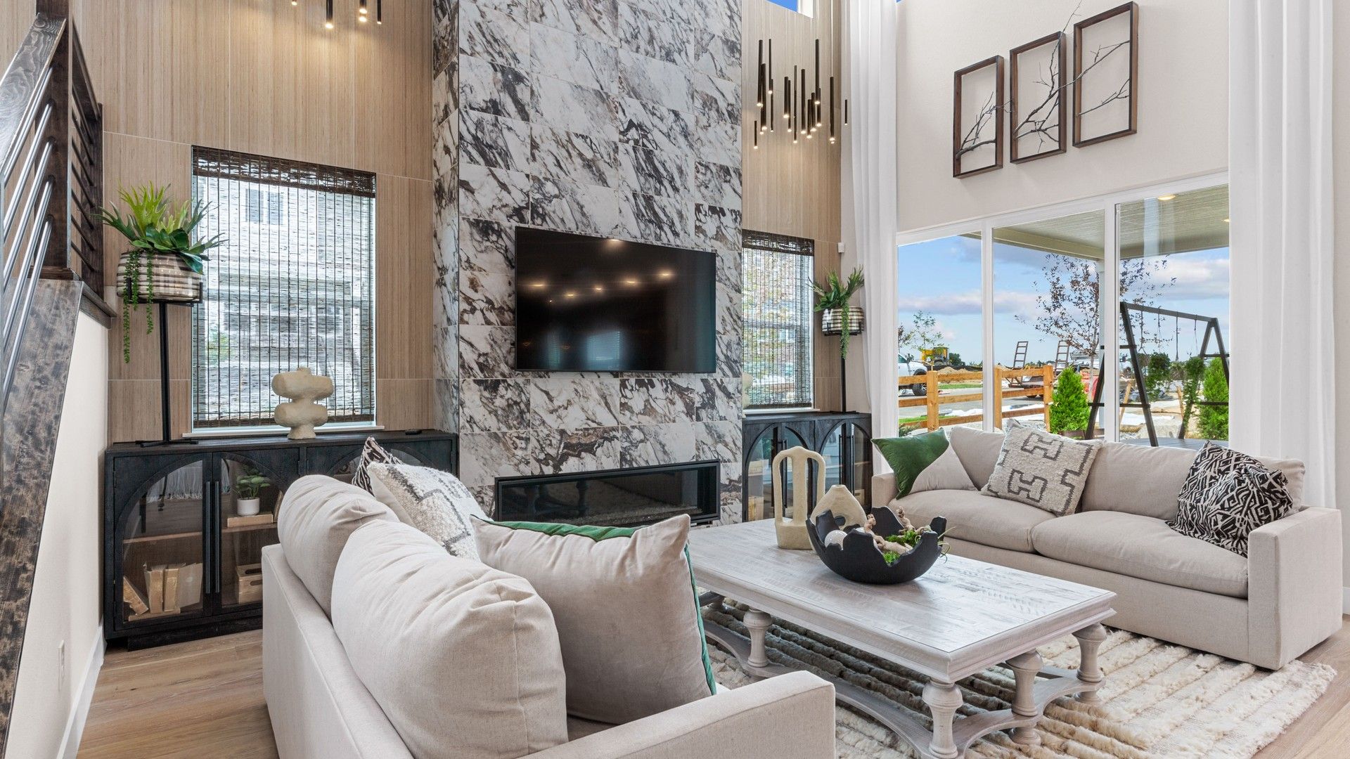 Experience Dillon Pointe's grandeur with a stunning marble fireplace, soaring ceilings, and expansive windows.