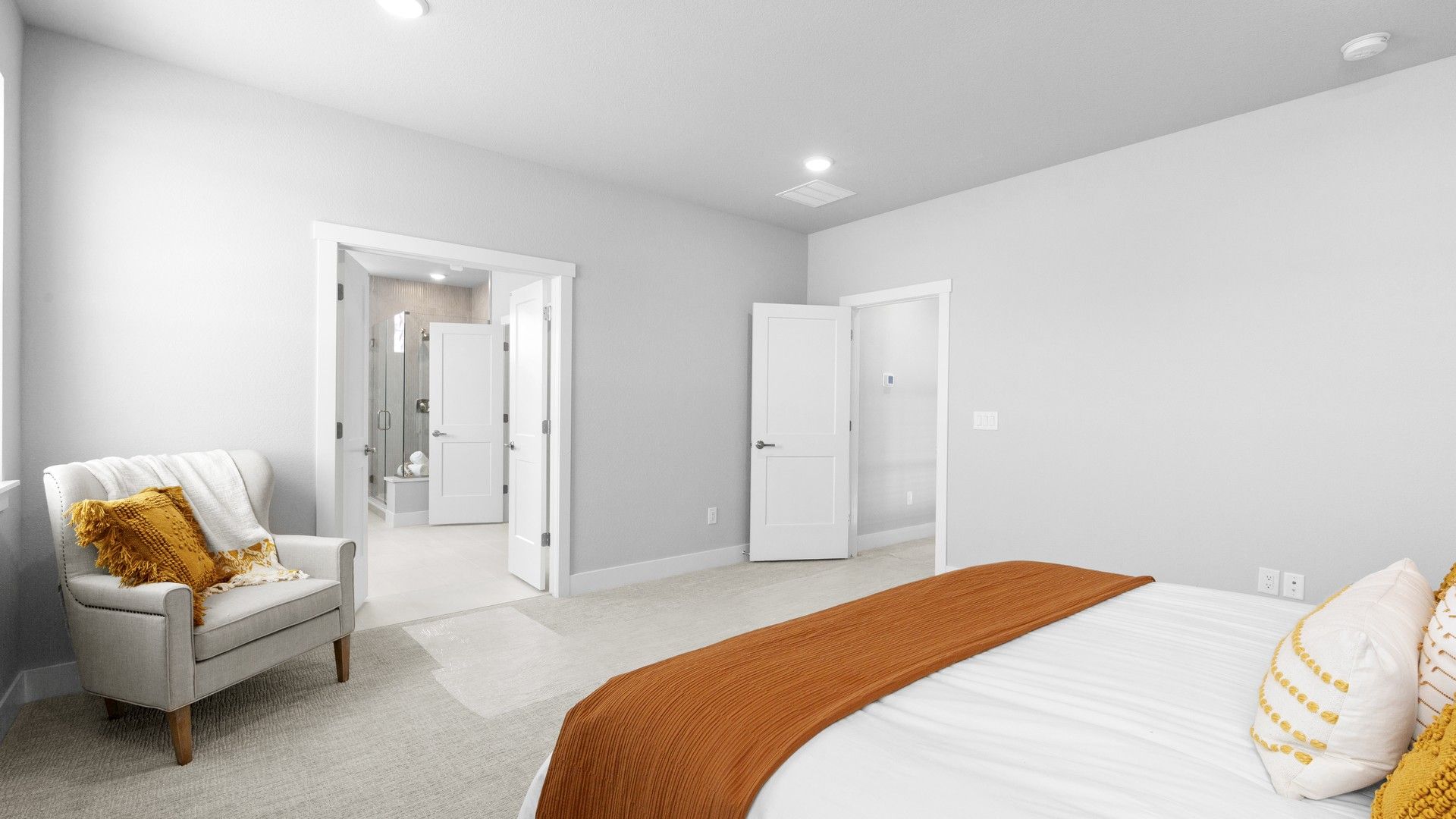 Luxurious bedroom features textured carpet and contemporary accents in prestigious Montaine location.