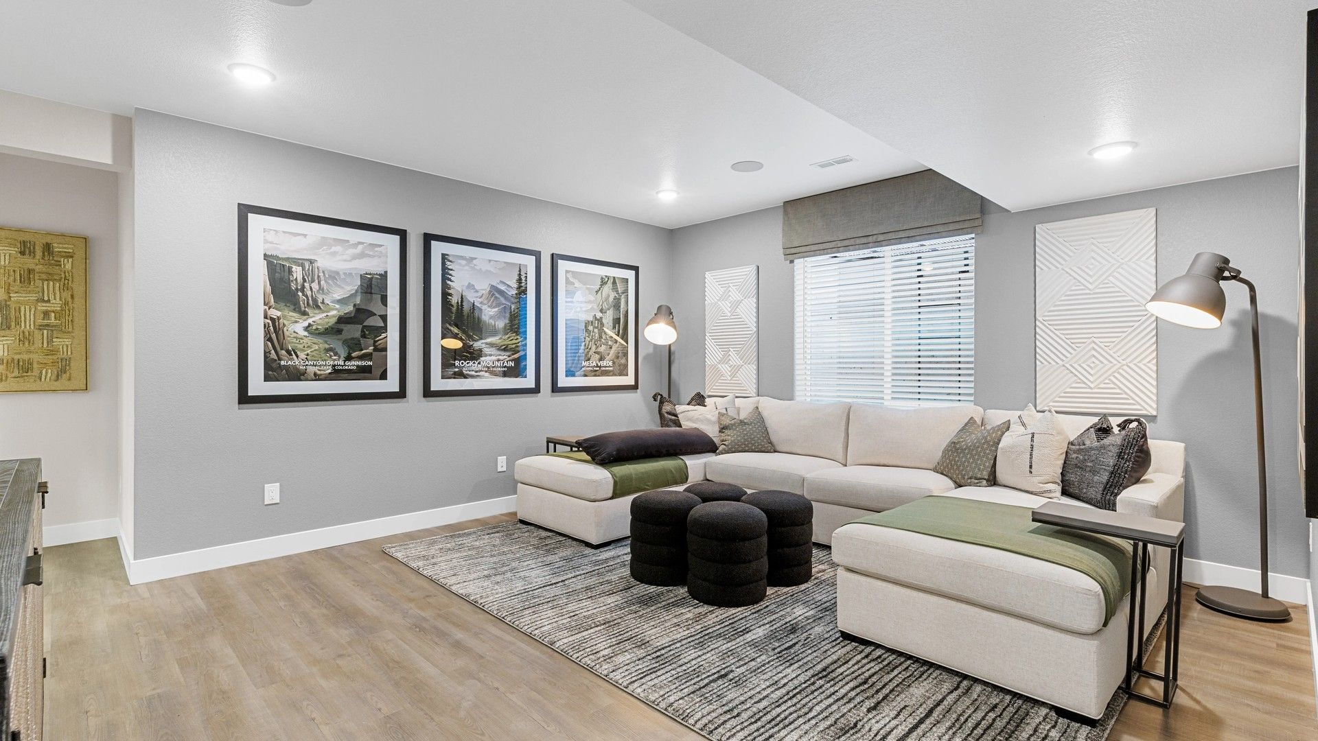 Elegant Timnath Lakes living area with chic sectional, plush rugs, and ambient lighting.
