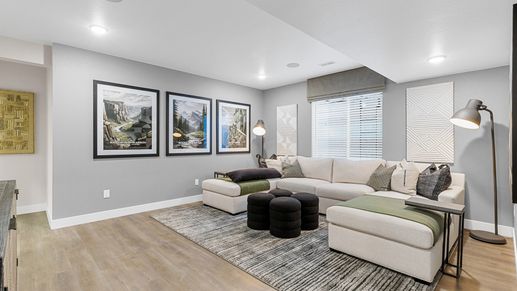 Elegant Timnath Lakes living area with chic sectional, plush rugs, and ambient lighting.