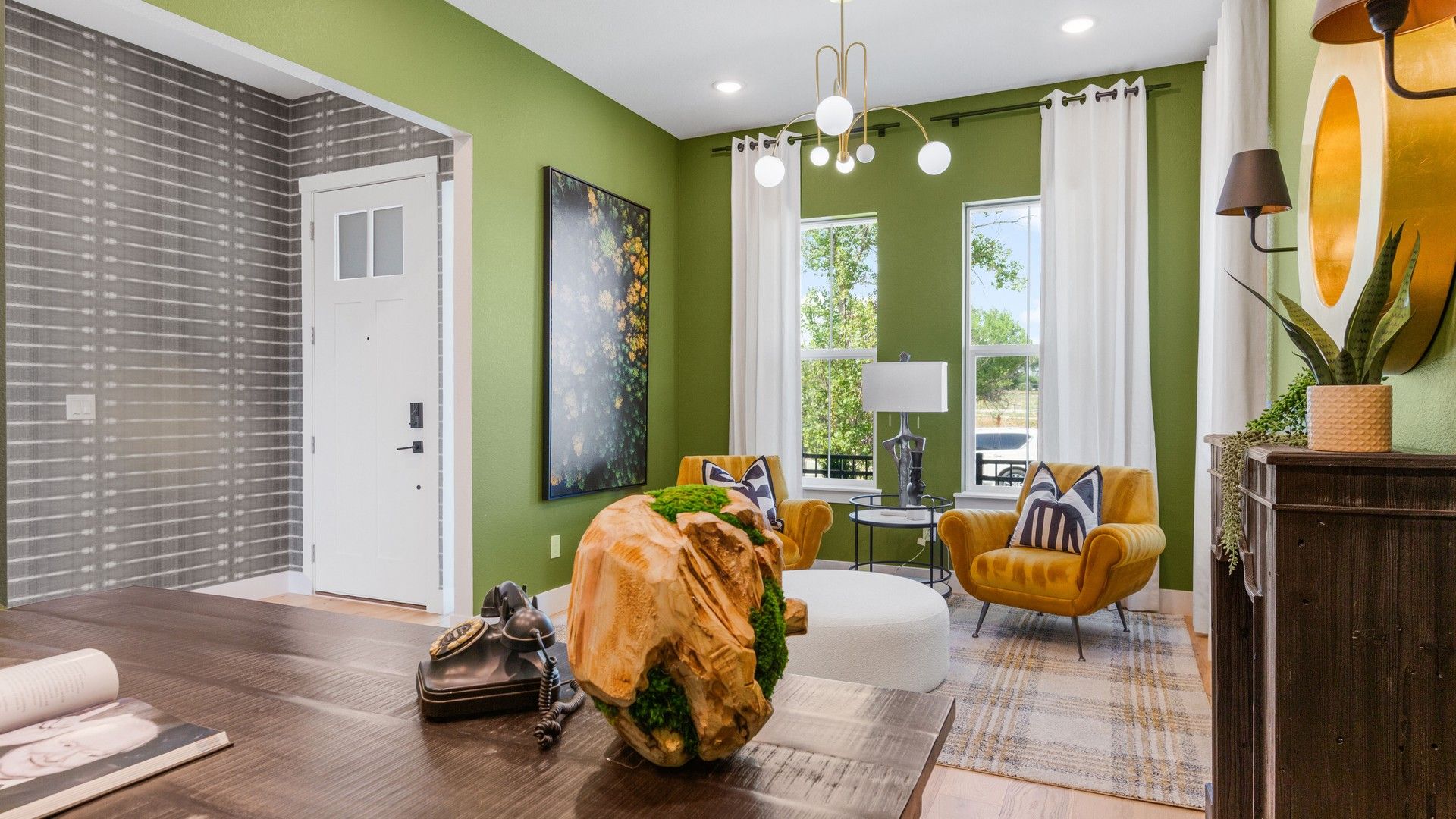 Delight in chic mustard seating, modern lighting, and expansive windows in this Dillon Pointe haven.