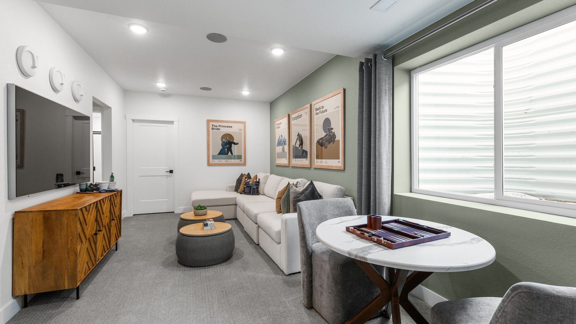 Enjoy contemporary elegance with plush seating, stylish decor, and ample natural light in this Fort Collins residence.