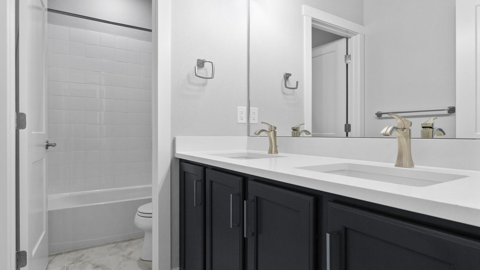 Experience elegance with dual sinks, sleek quartz surfaces, and premium fixtures in Montaine's refined setting.