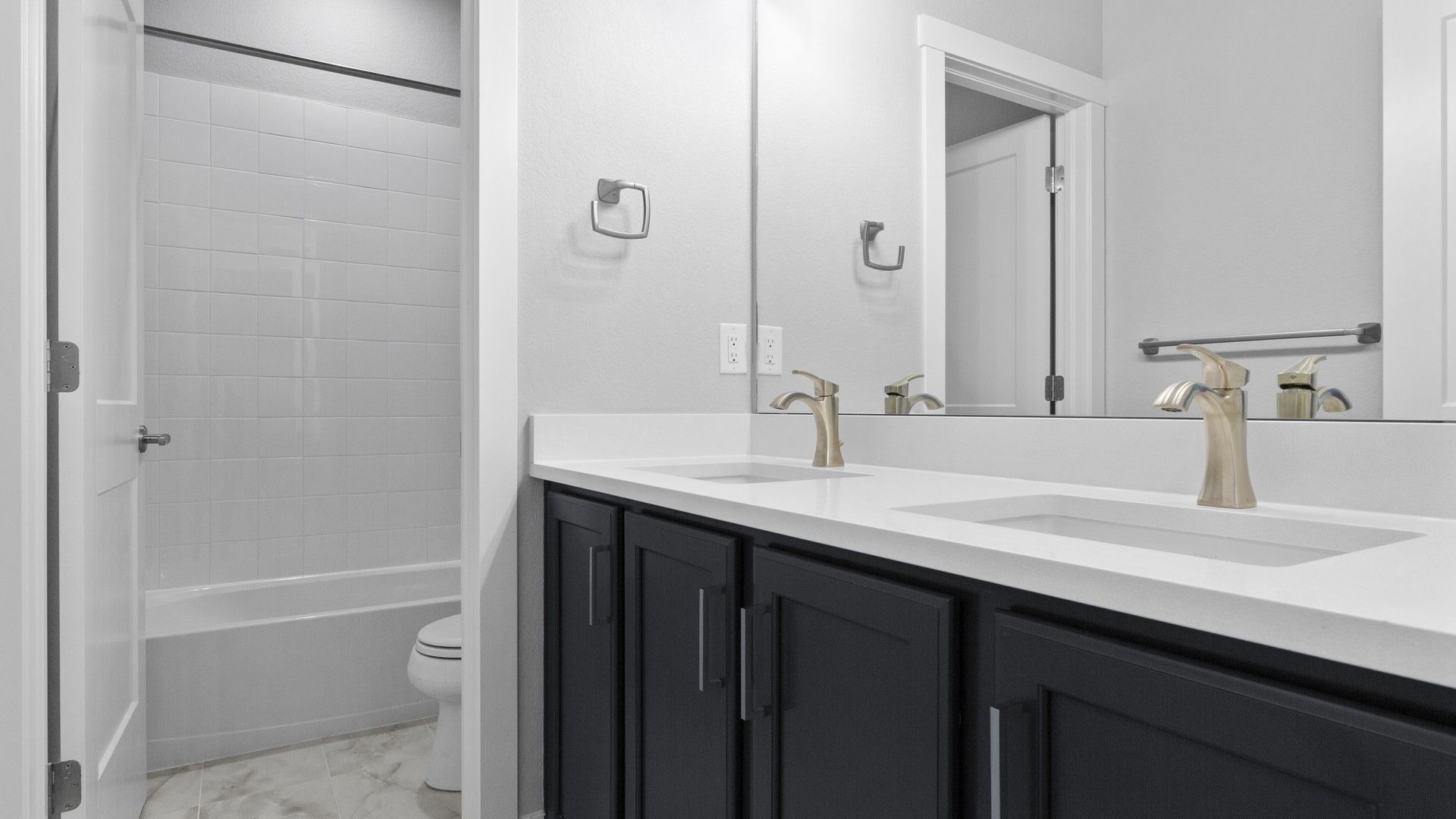 Experience elegance with dual sinks, sleek quartz surfaces, and premium fixtures in Montaine's refined setting.