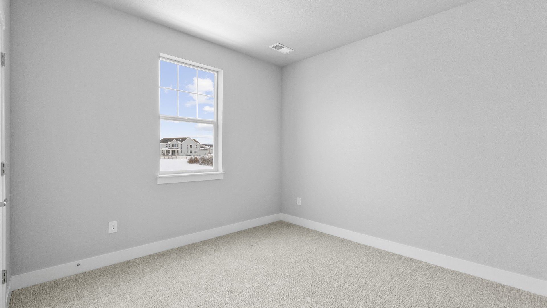 Luxurious minimalist room with plush carpet and serene views of Montaine community.