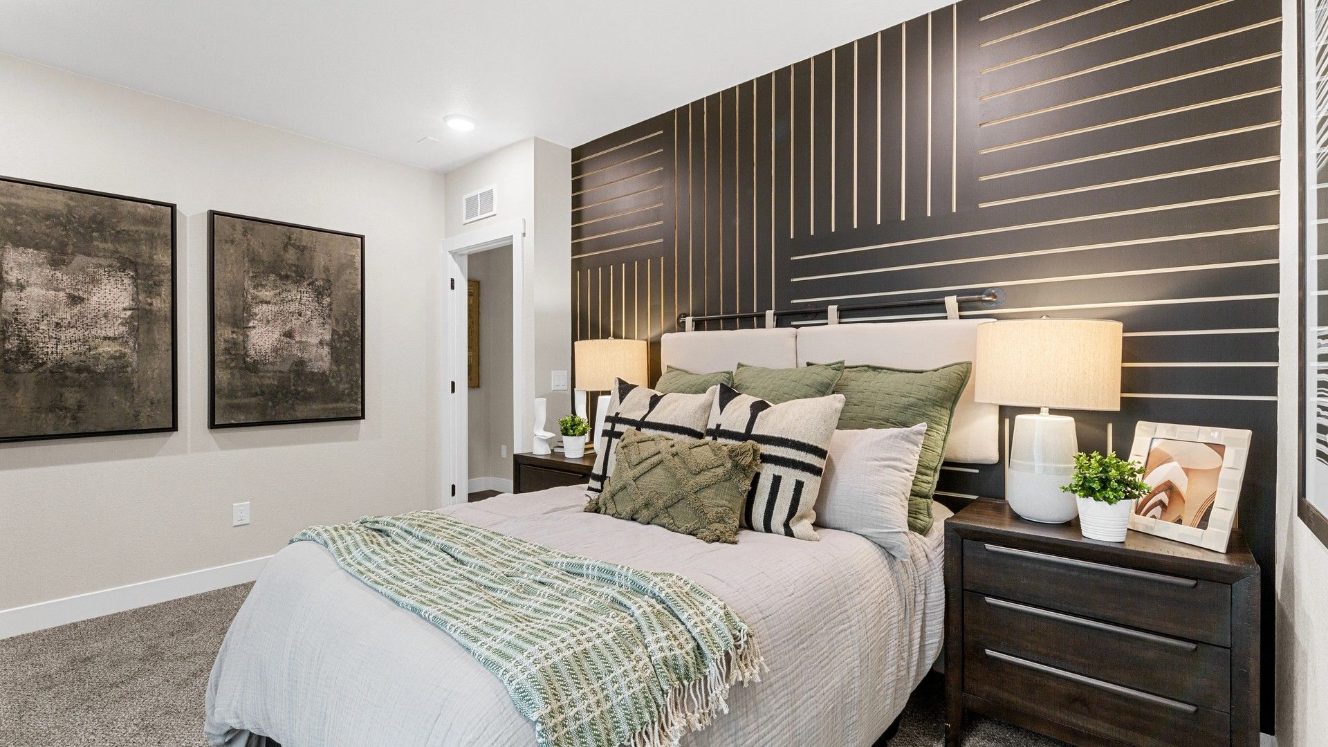 Indulge in luxury with a chic geometric accent wall and refined decor at Timnath Lakes.