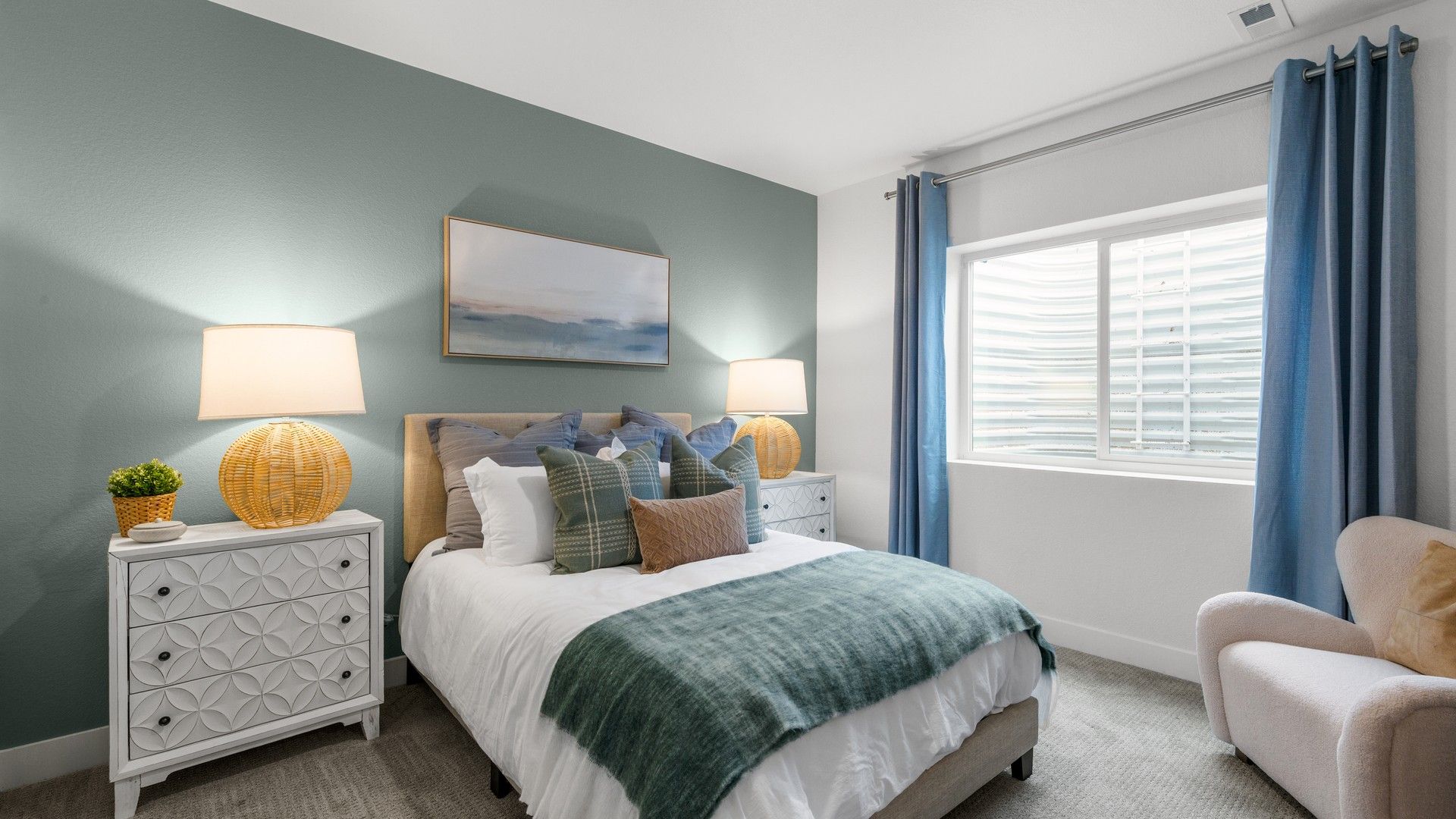 This exquisite bedroom features designer textiles and unique nightstands, set in a sophisticated urban location.