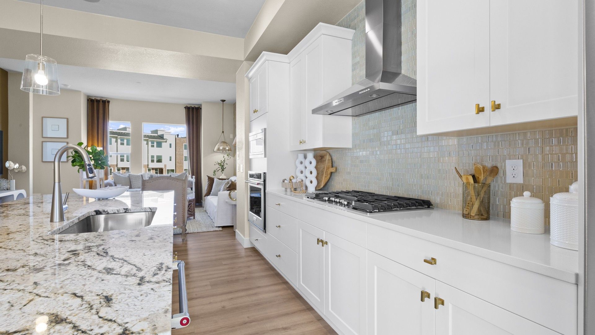 Granite countertops and custom cabinetry define this refined Dillon Pointe kitchen. [86]