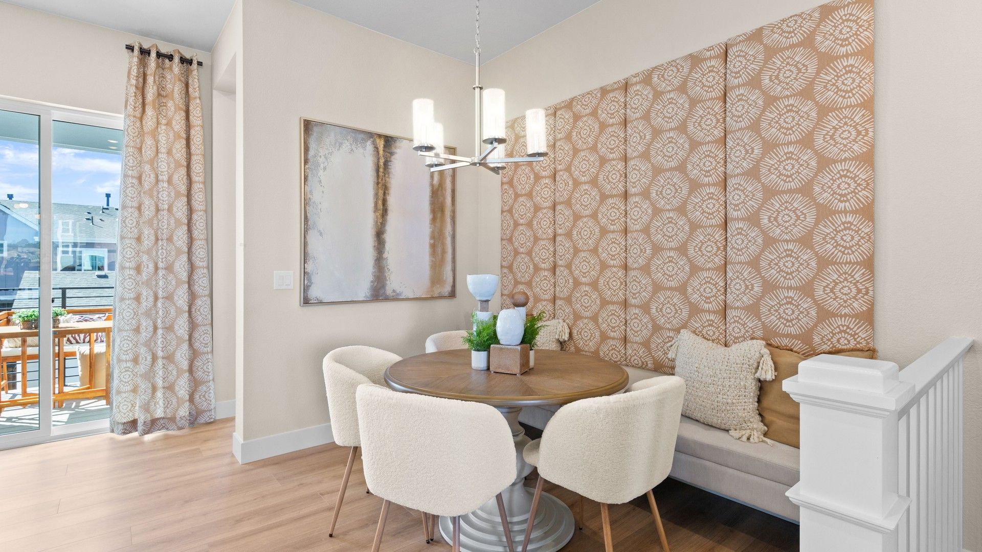 Chic dining nook with plush seating and exquisite wall design in Dillon Pointe.