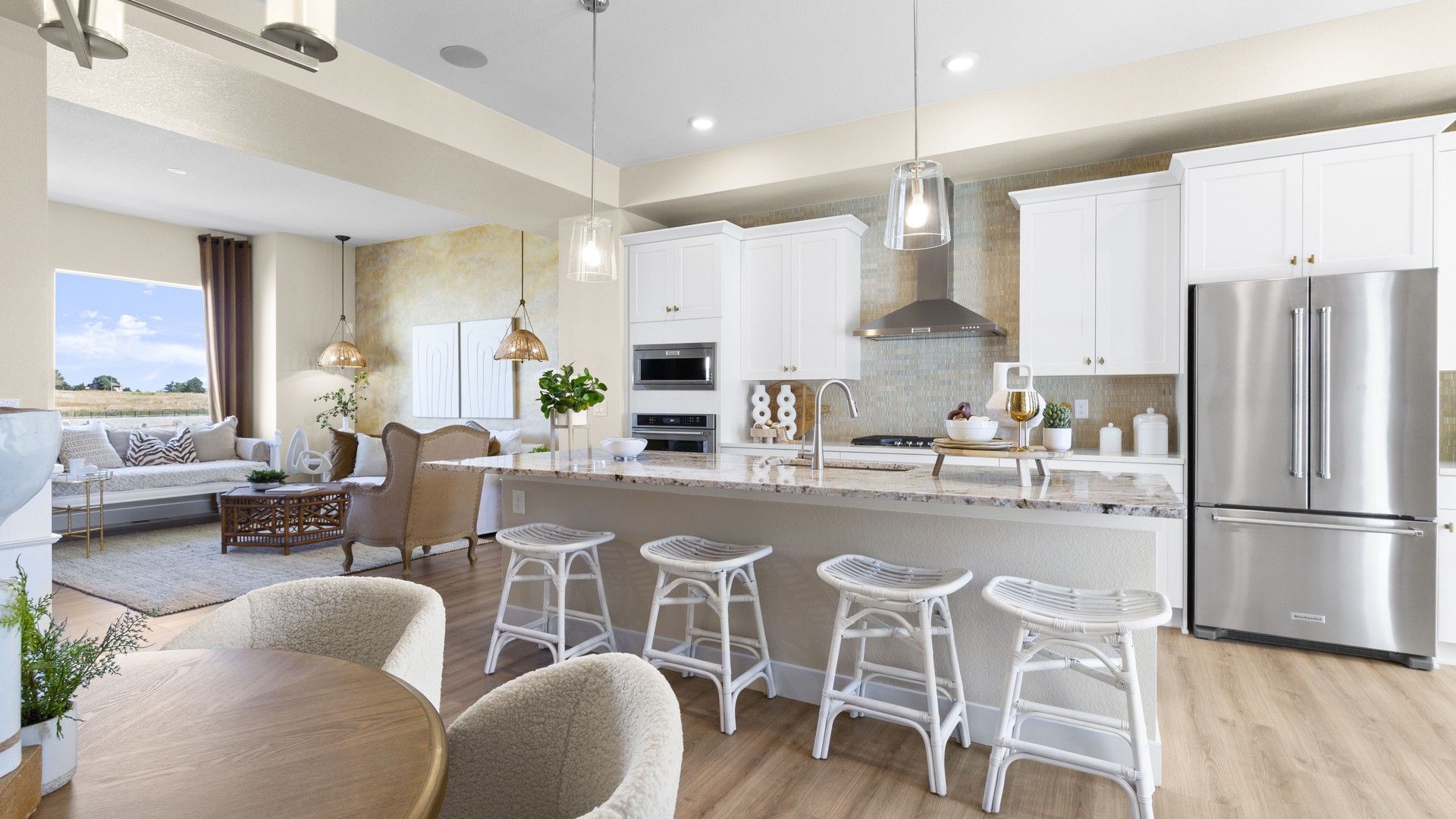 Exquisite marble counters and sleek stainless-steel appliances define this Dillon Pointe haven.