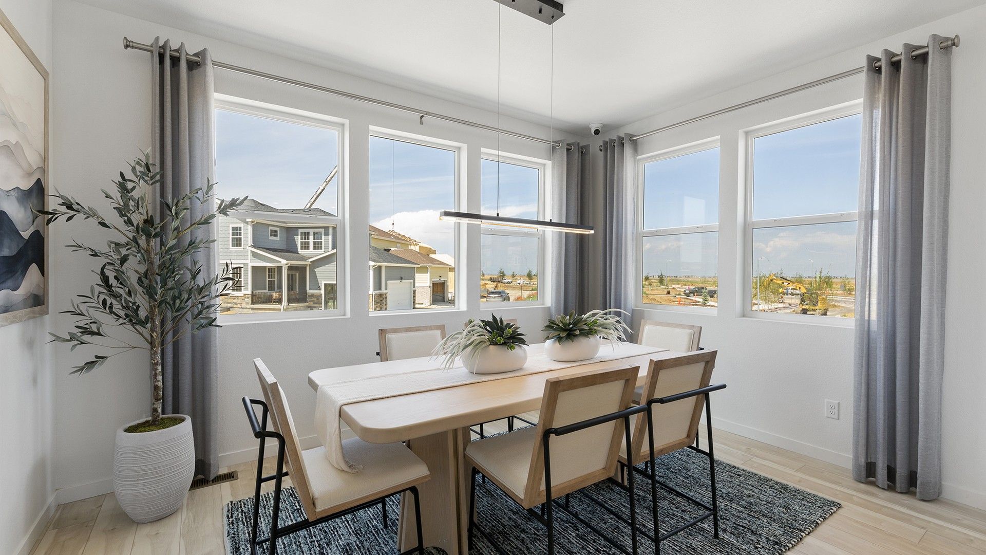 Experience luxury architecture in this single-family home's stylish dining space with modern design elements.