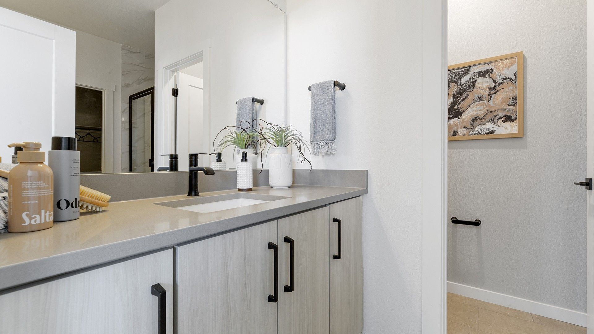 Experience luxury in modern architecture with this sleek single-family home bathroom design.
