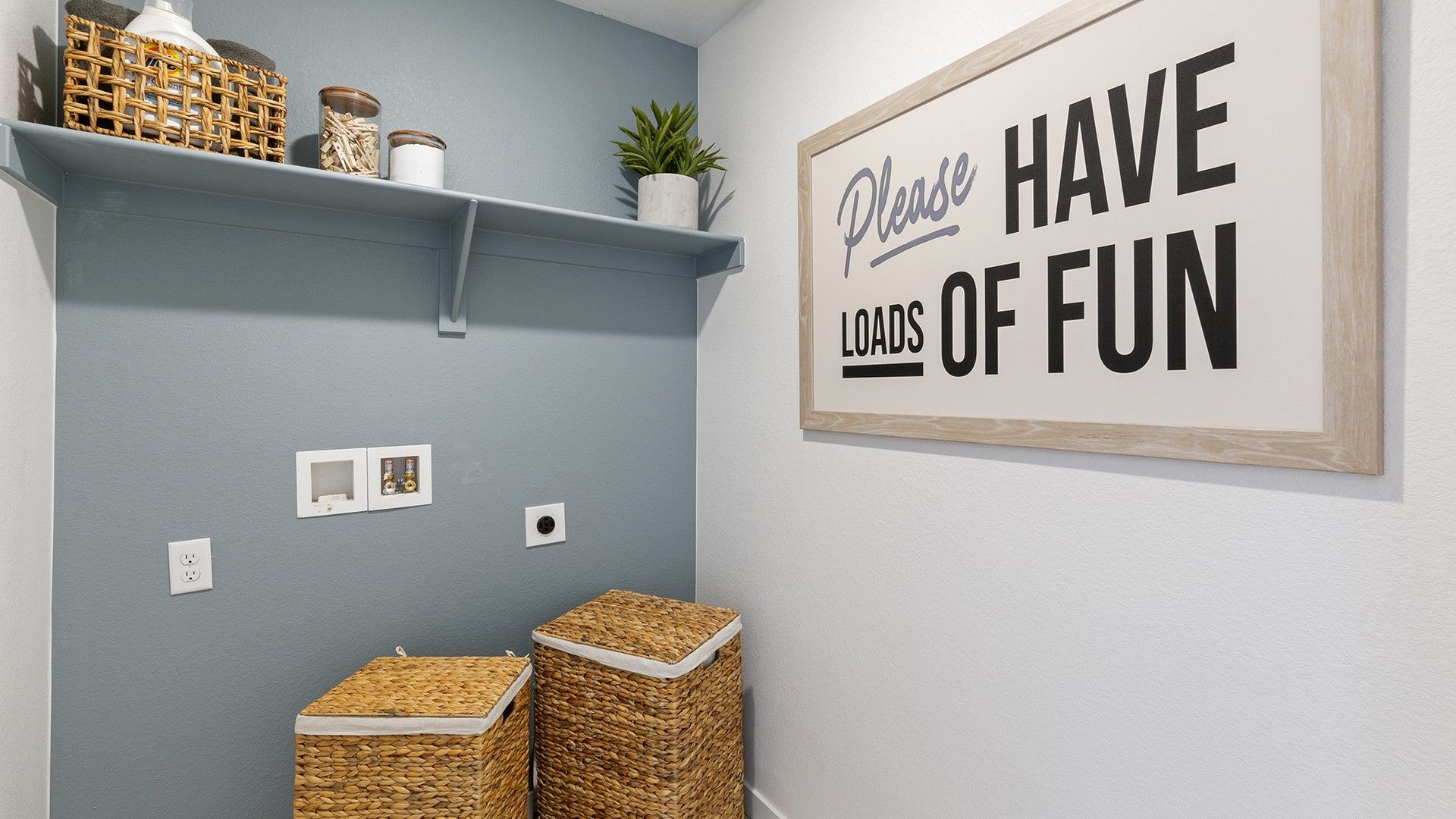 Experience luxury in residential architecture with this sleek laundry design in a modern single-family home.