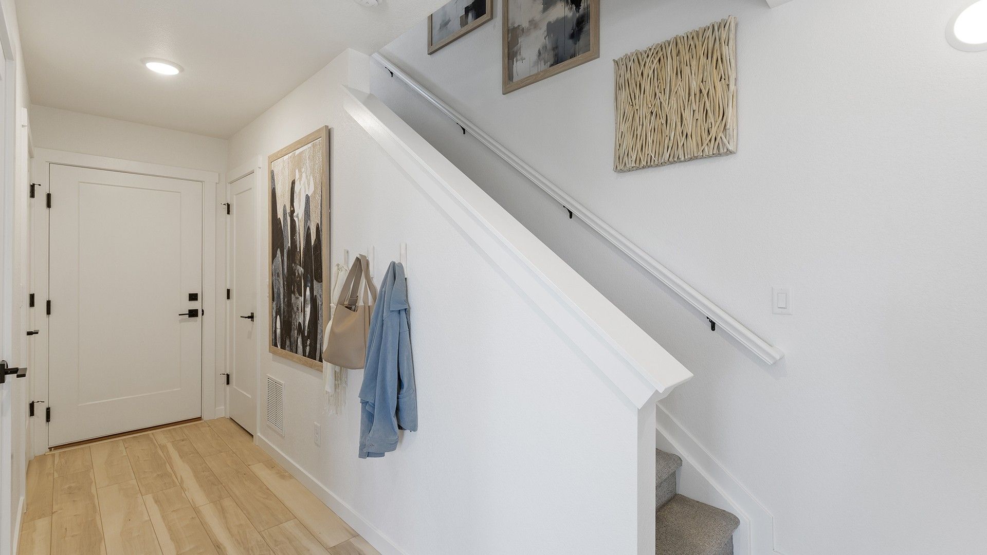 Experience the luxury of elegant design in this modern single-family home entryway.