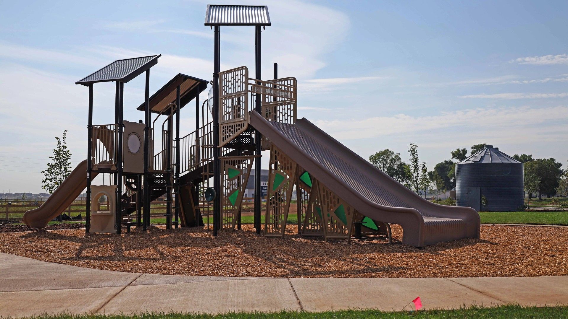 Enjoy cutting-edge play structures amidst lush landscapes in Granary's vibrant park.